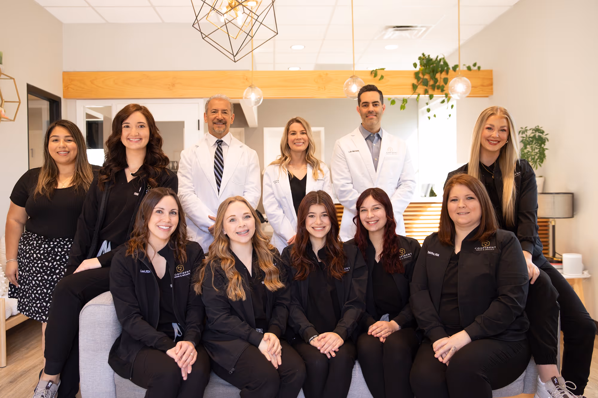 A group of women and men posing for a picture.