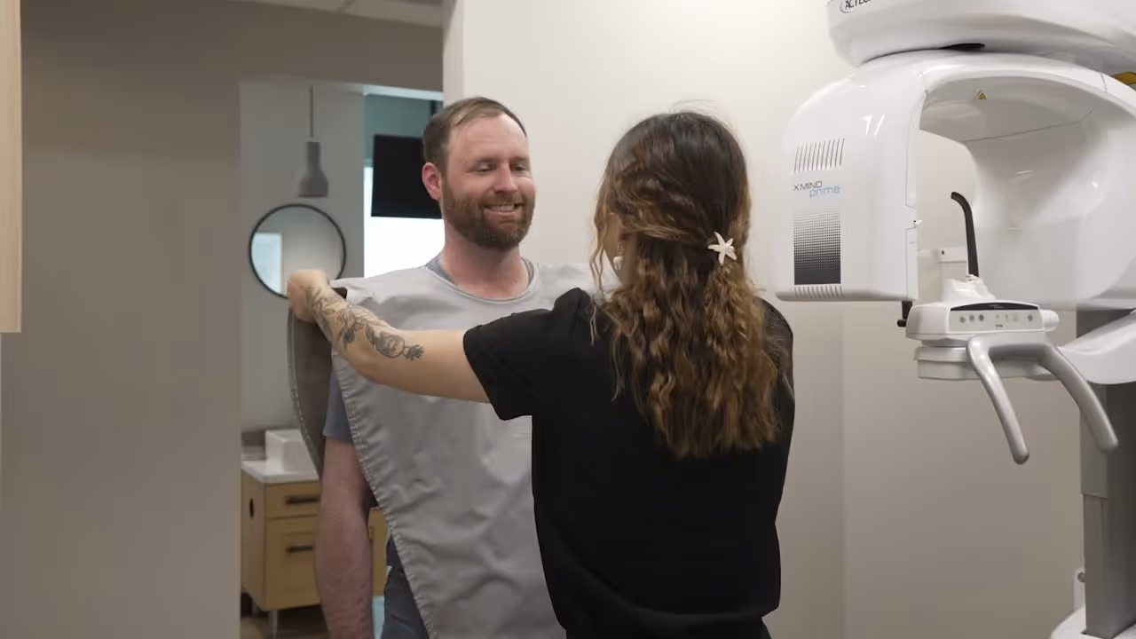 A man and a woman standing in a room.