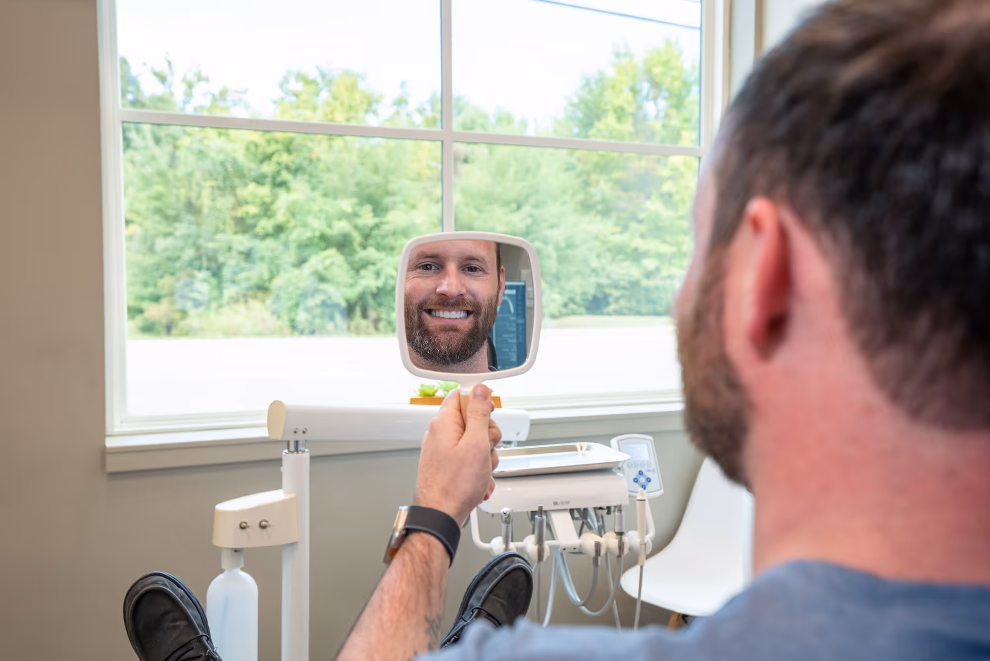 A man taking a picture of himself in a mirror.