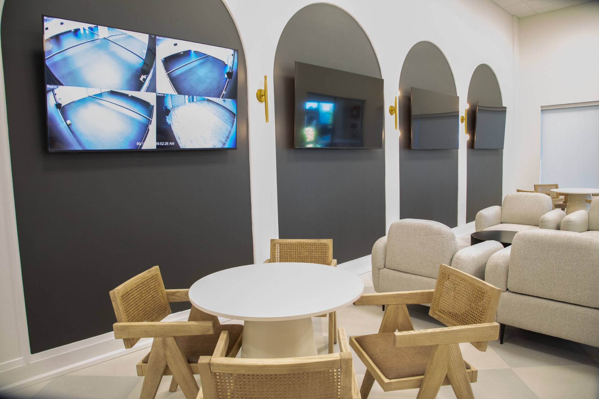 Parent lounge with live studio viewing screens at The NINE Dance Academy