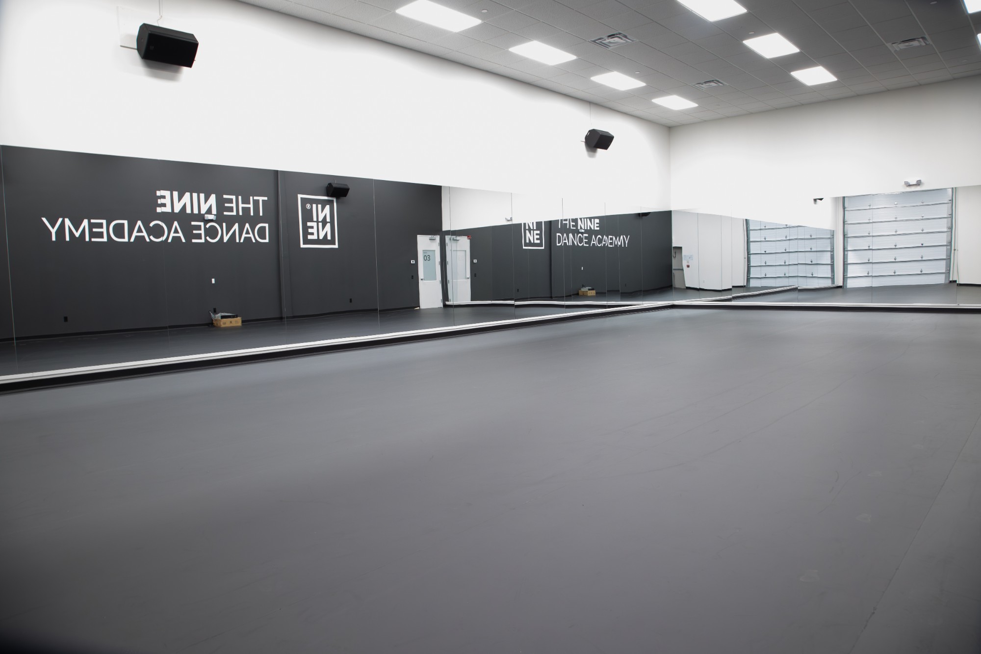 Floor-to-ceiling mirrors and marley flooring inside a NINE dance studio