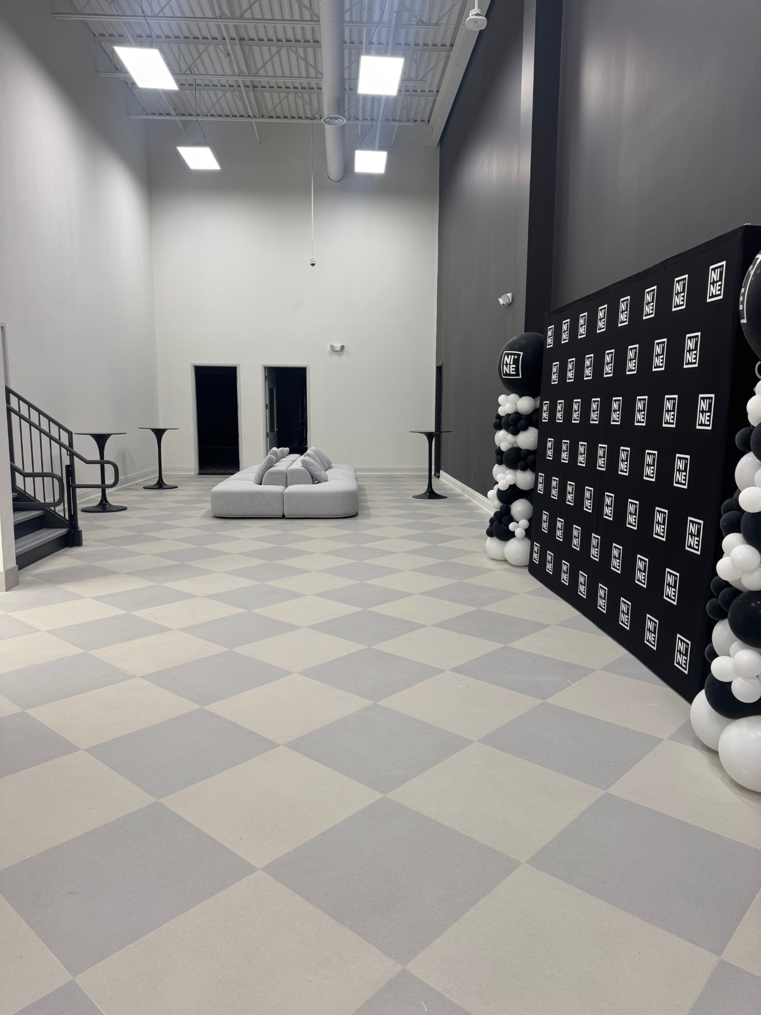 Event space with NINE step-and-repeat backdrop at The NINE Dance Academy