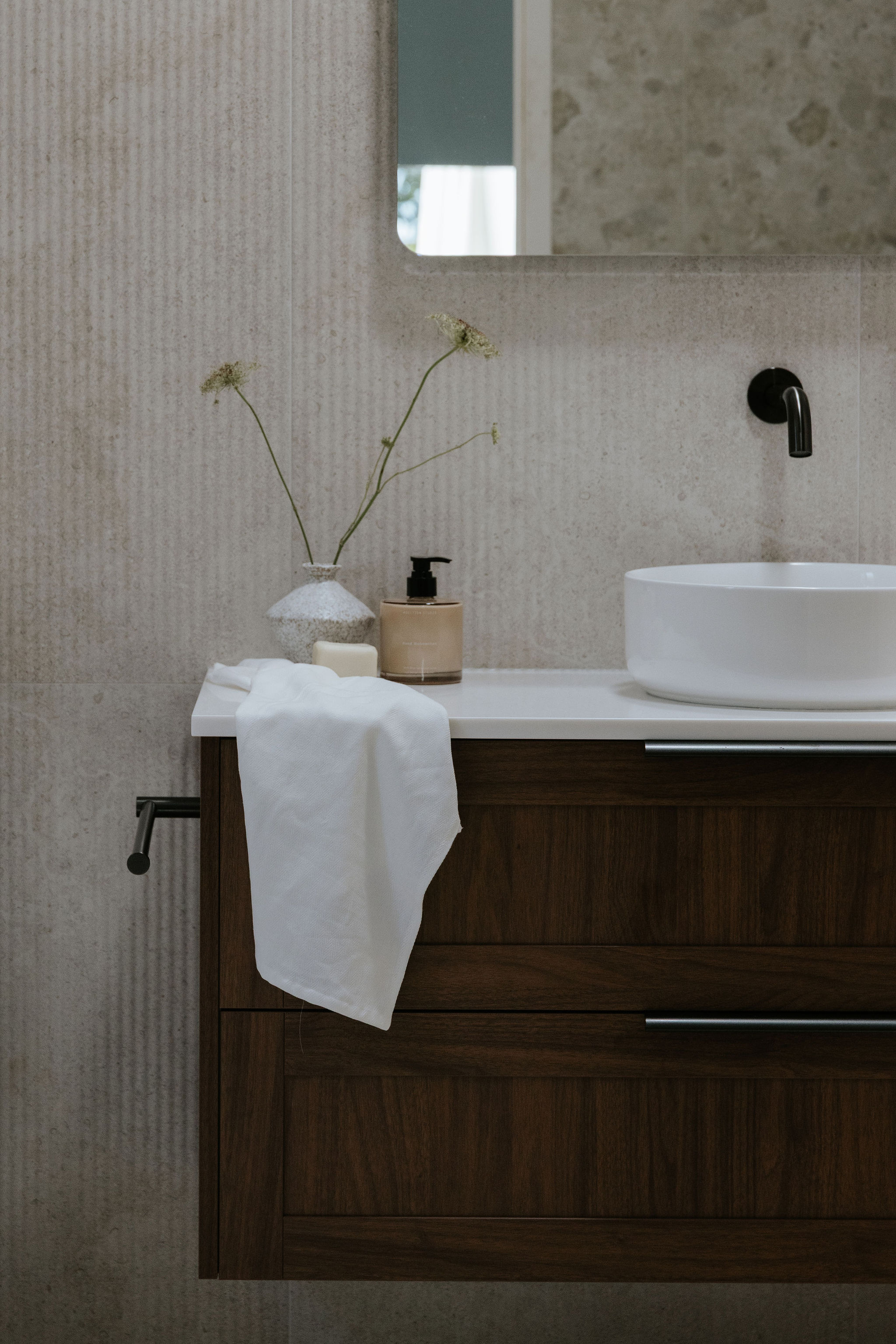 Bathroom vanity and mirror in a Sunshine Coast renovation designed by Pearl Interiors