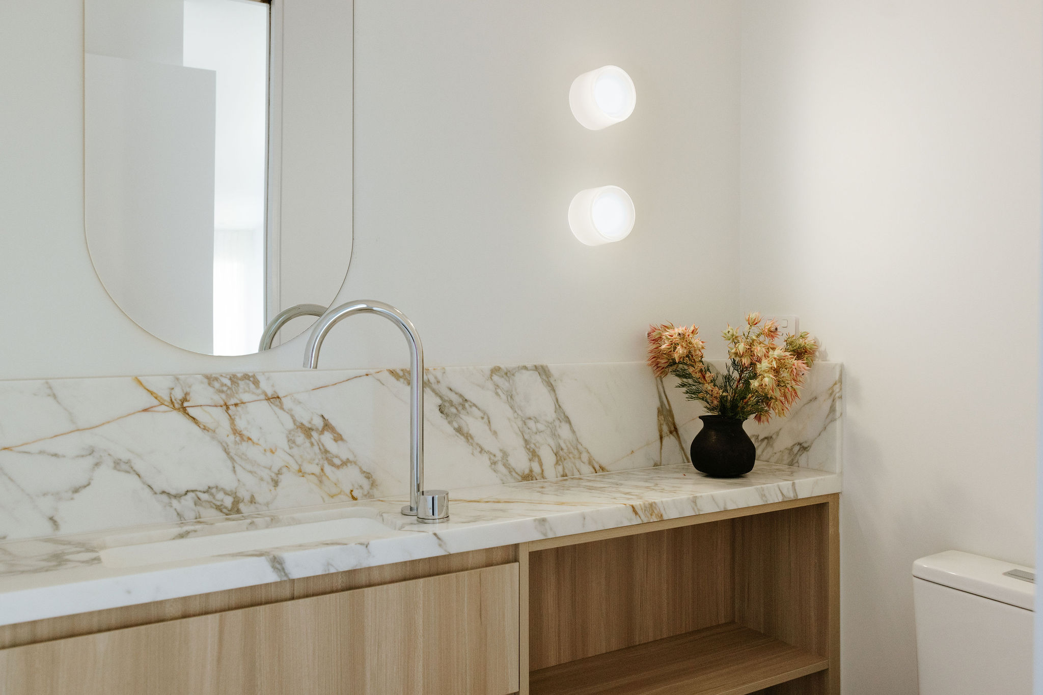 Timber and stone material detail, kitchen, laundry and powder room renovation on Orient Drive, Sunrise Beach by Pearl Interiors, built with Nomad Builders, Franca Designs stone benchtops and Faucet Strommen tapware, Sunshine Coast