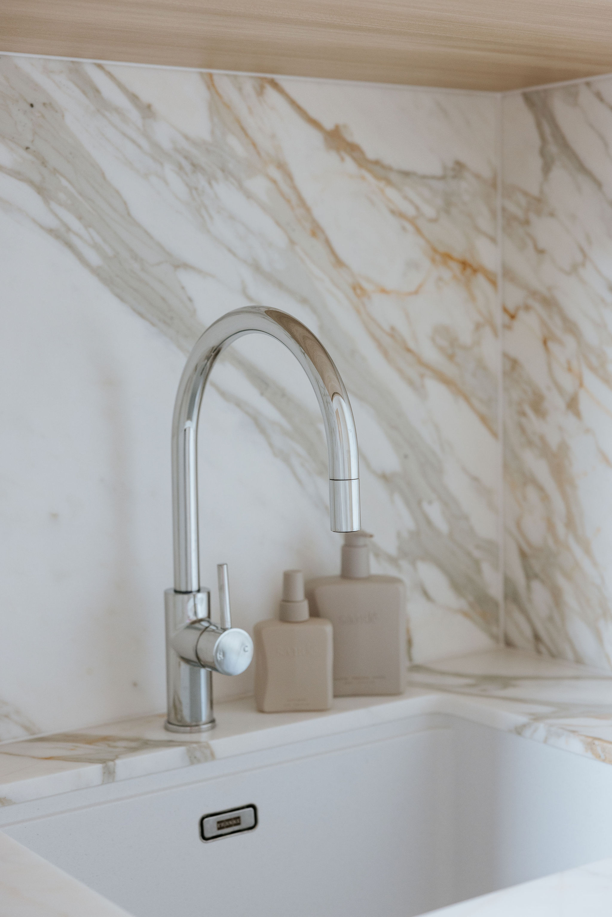 Coastal dining zone, kitchen, laundry and powder room renovation on Orient Drive, Sunrise Beach by Pearl Interiors, built with Nomad Builders, Franca Designs stone benchtops and Faucet Strommen tapware, Sunshine Coast