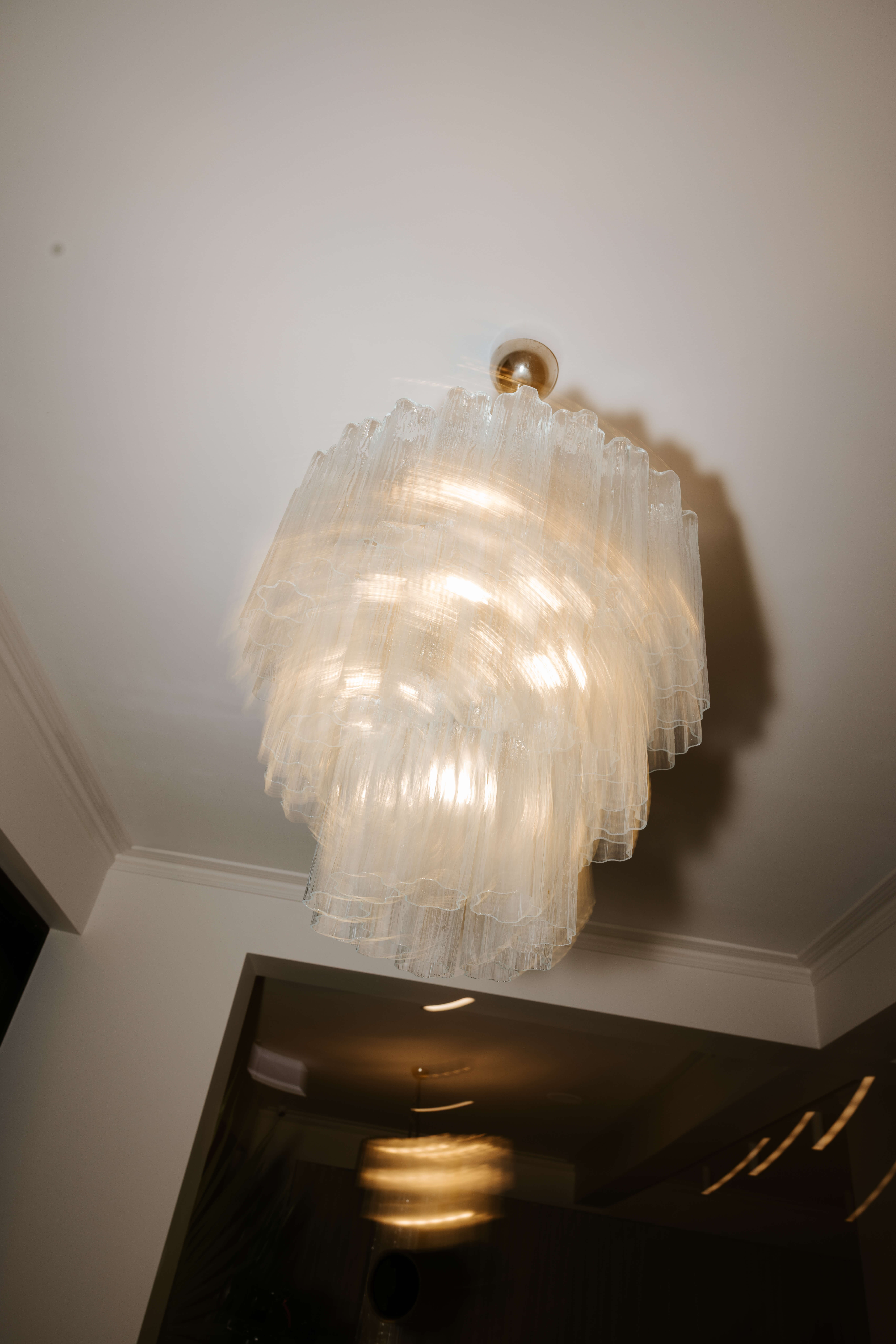 Vintage lighting feature, Pearl Interiors flagship design studio in Noosa Heads, Sunshine Coast, natural stone, timber joinery and vintage lighting