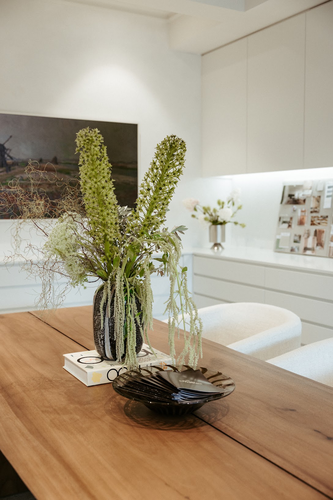 Feature pendant lighting, Pearl Interiors flagship design studio in Noosa Heads, Sunshine Coast, natural stone, timber joinery and vintage lighting