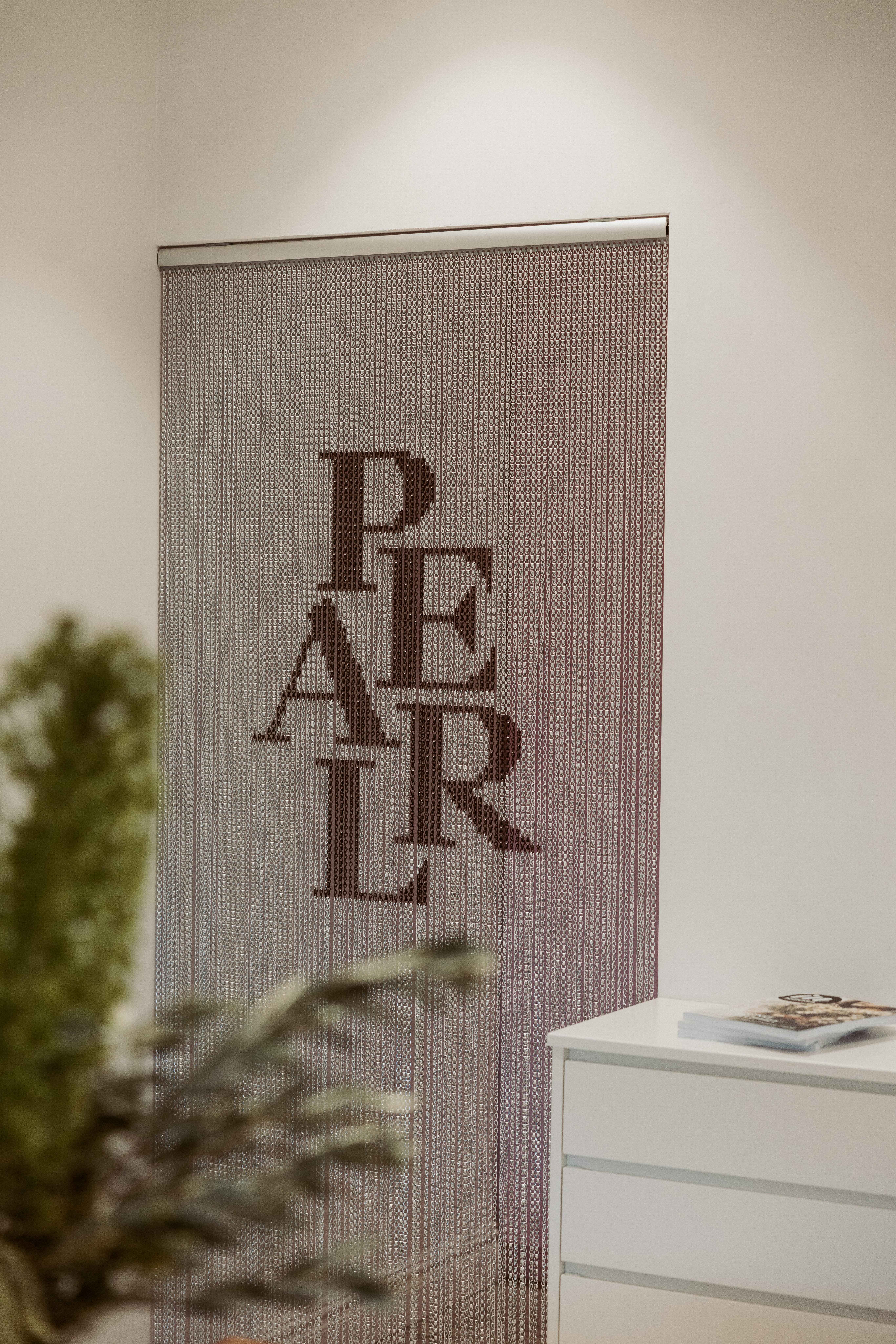 Meeting and consultation space, Pearl Interiors flagship design studio in Noosa Heads, Sunshine Coast, natural stone, timber joinery and vintage lighting