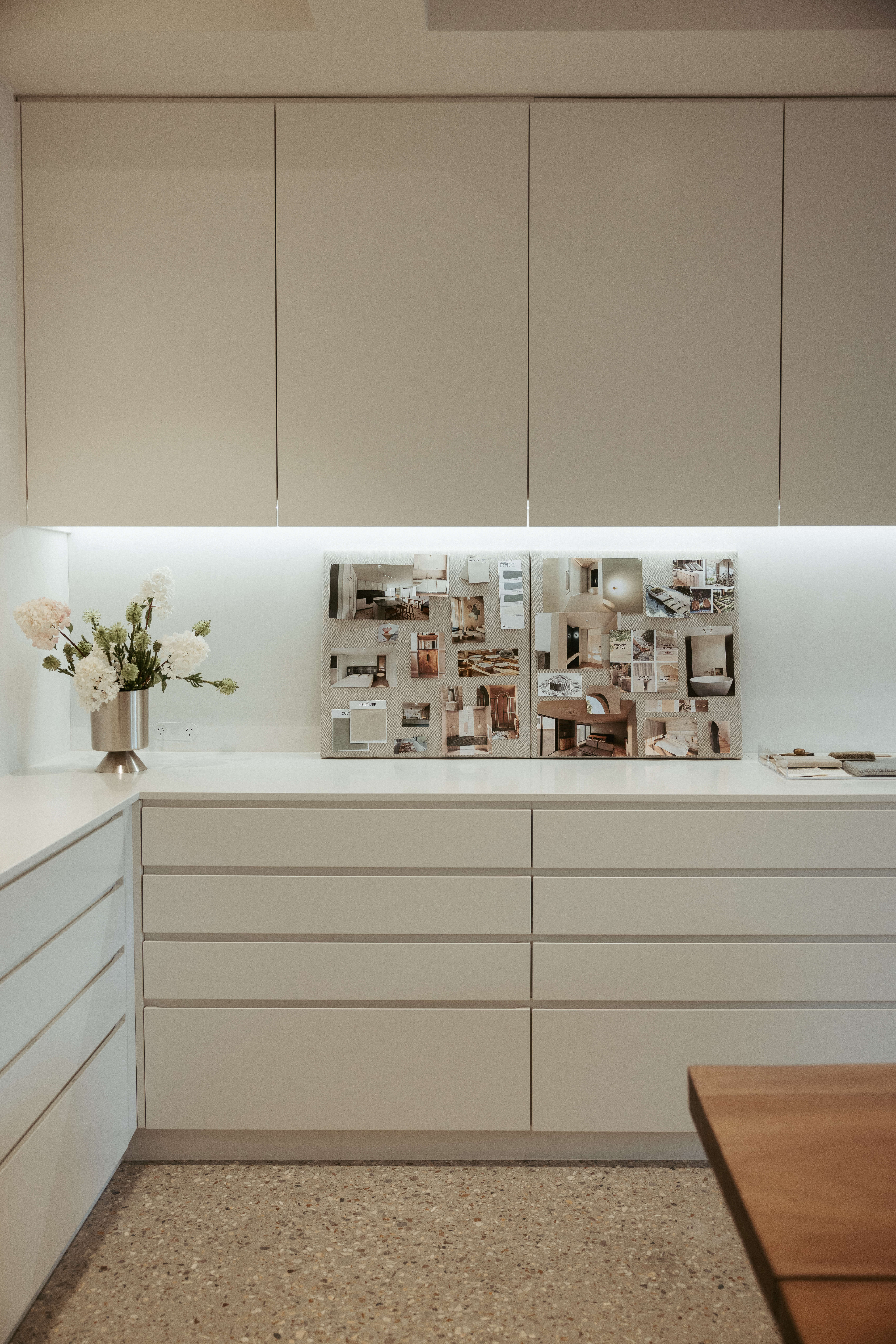 Considered materiality, Pearl Interiors flagship design studio in Noosa Heads, Sunshine Coast, natural stone, timber joinery and vintage lighting