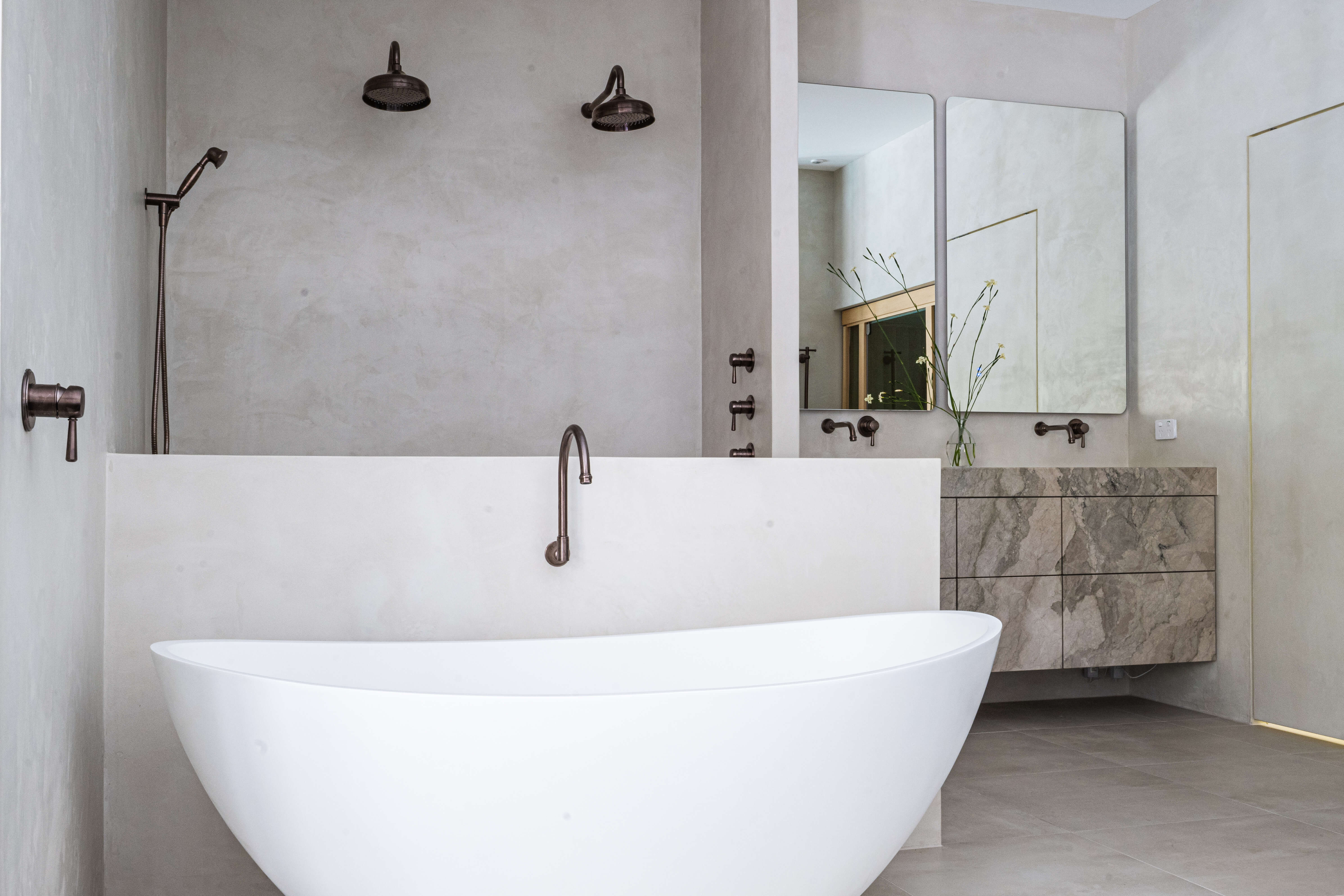 Natural stone tiling detail, moody spa-inspired parents' bathroom renovation in Timbeerwah, Noosa Hinterland by Pearl Interiors, built with Squire Development Group, Ace Stone and Tile stone tiling and Faucet Strommen tapware