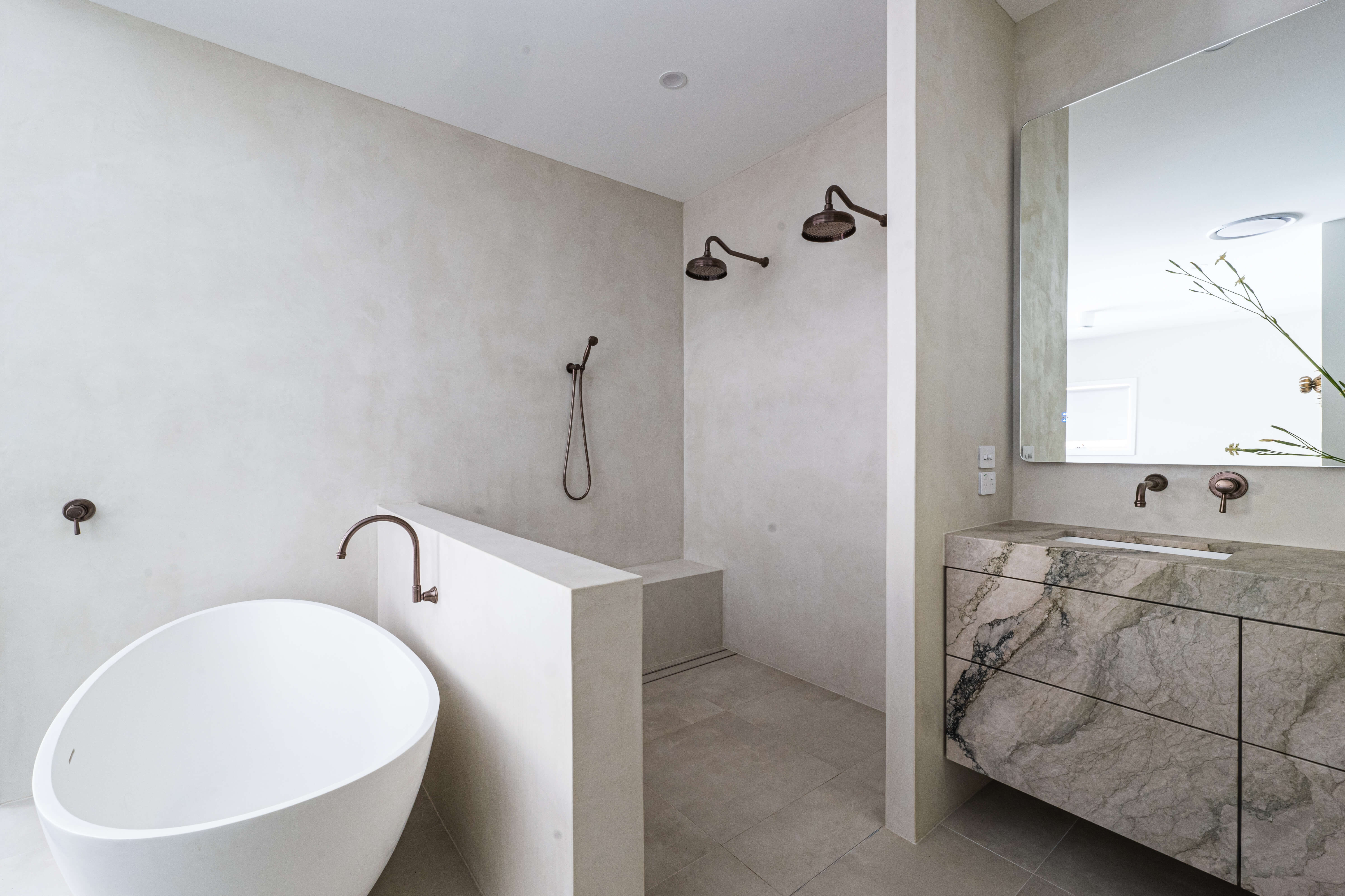 Textured stone surfaces, moody spa-inspired parents' bathroom renovation in Timbeerwah, Noosa Hinterland by Pearl Interiors, built with Squire Development Group, Ace Stone and Tile stone tiling and Faucet Strommen tapware