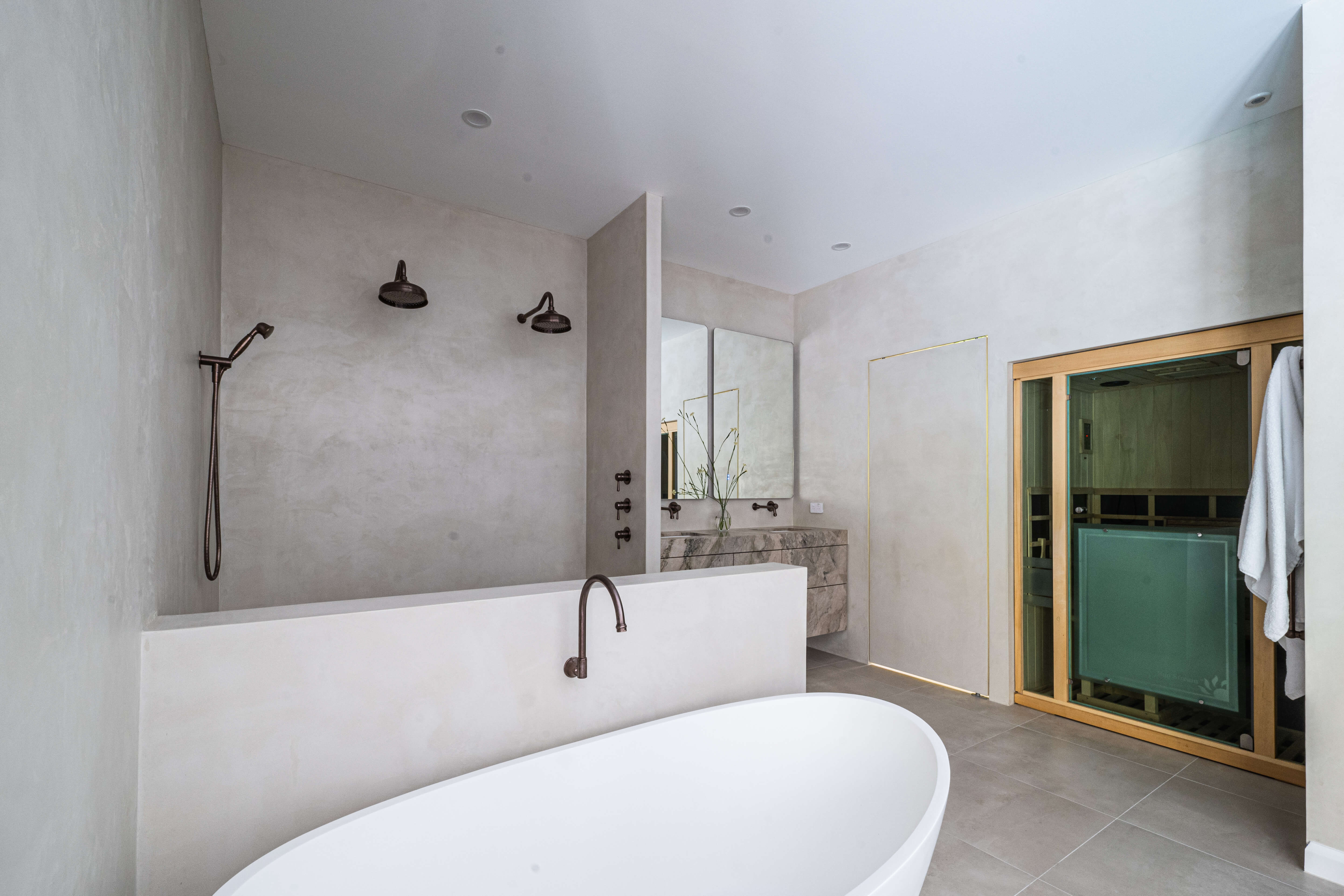 Completed Timbeerwah retreat, moody spa-inspired parents' bathroom renovation in Timbeerwah, Noosa Hinterland by Pearl Interiors, built with Squire Development Group, Ace Stone and Tile stone tiling and Faucet Strommen tapware