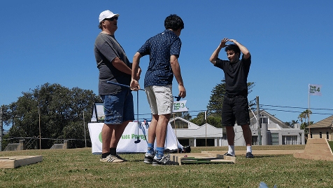 group of friends playing mini golf Putt Party
