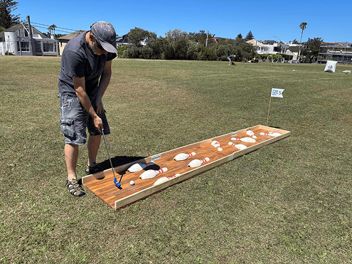 Man playing at Putt Party
