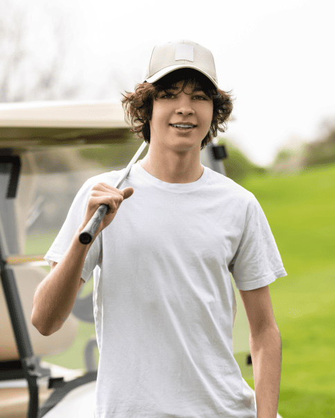 kid holding a gold club