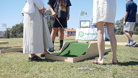People playing mini golf with Putt Party