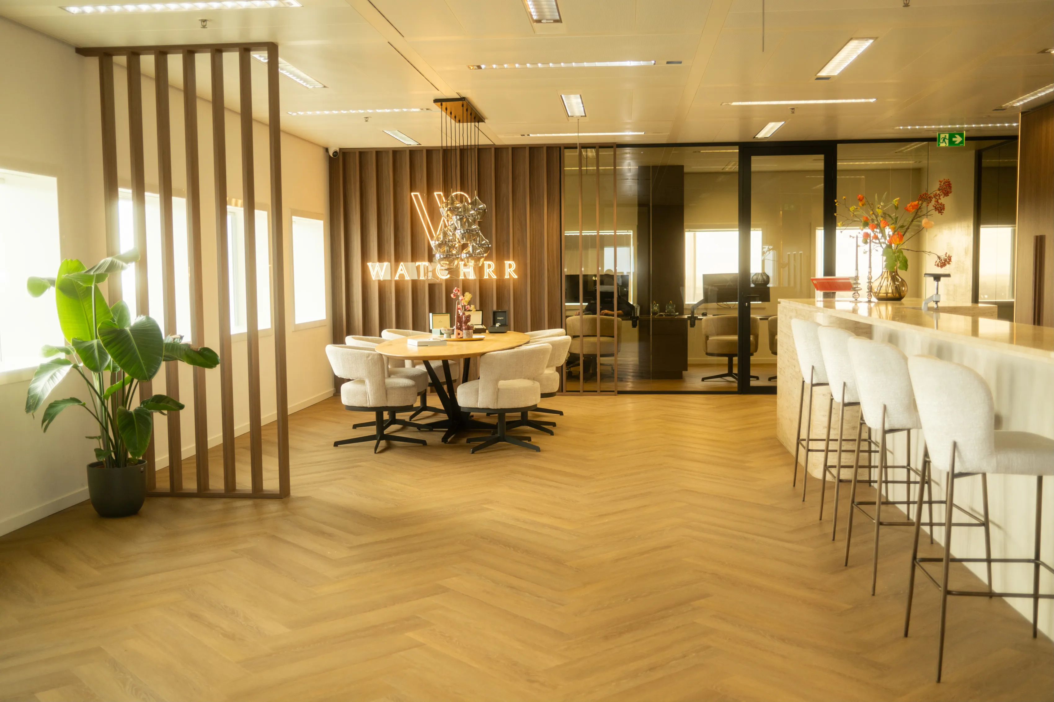 Watchrr founder Jesse Luinstra at his pre-owned luxury watch boutique in Leeuwarden, looking at the camera.