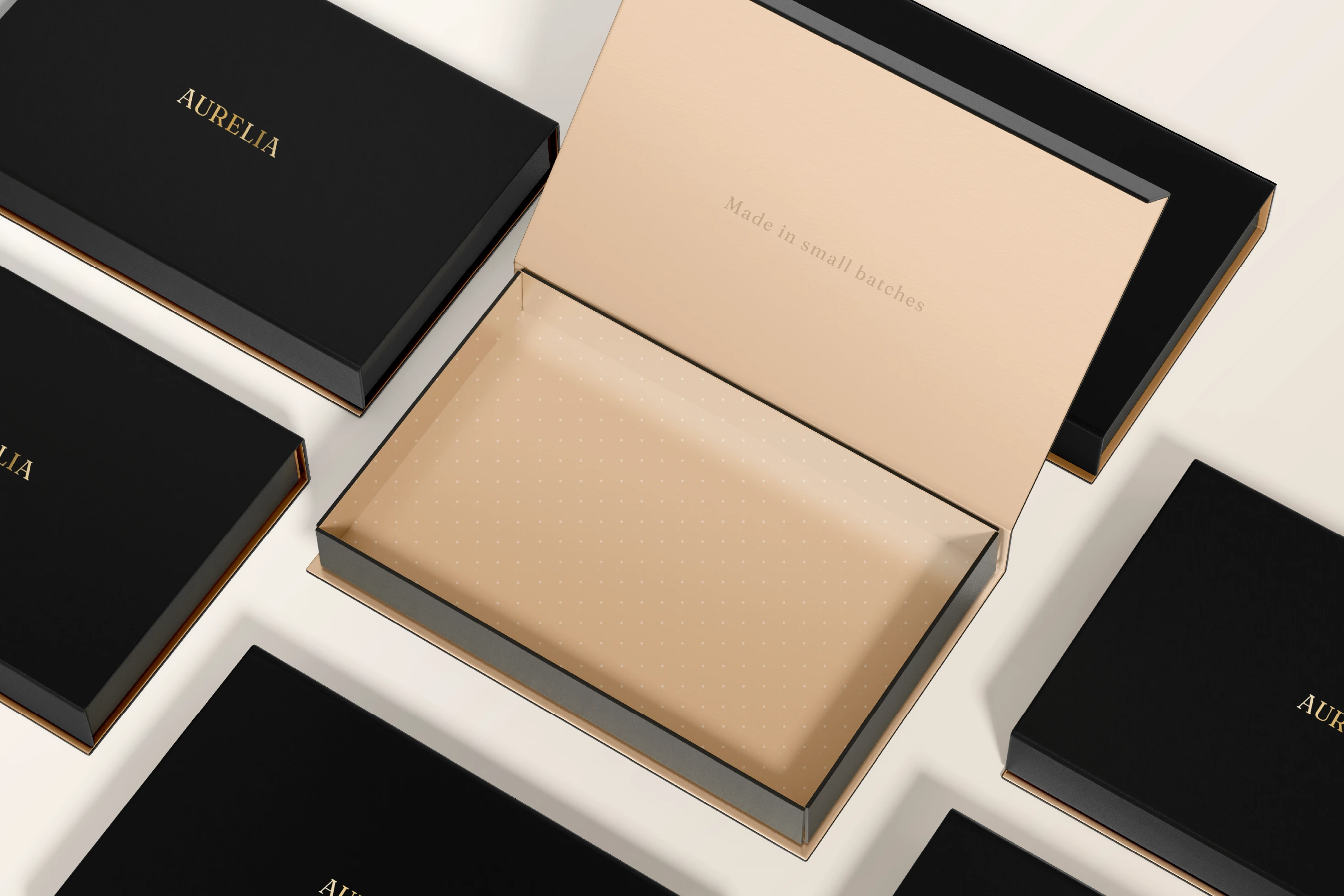 Aurelia luxury packaging system with branded boxes, tissue, and ribbon.