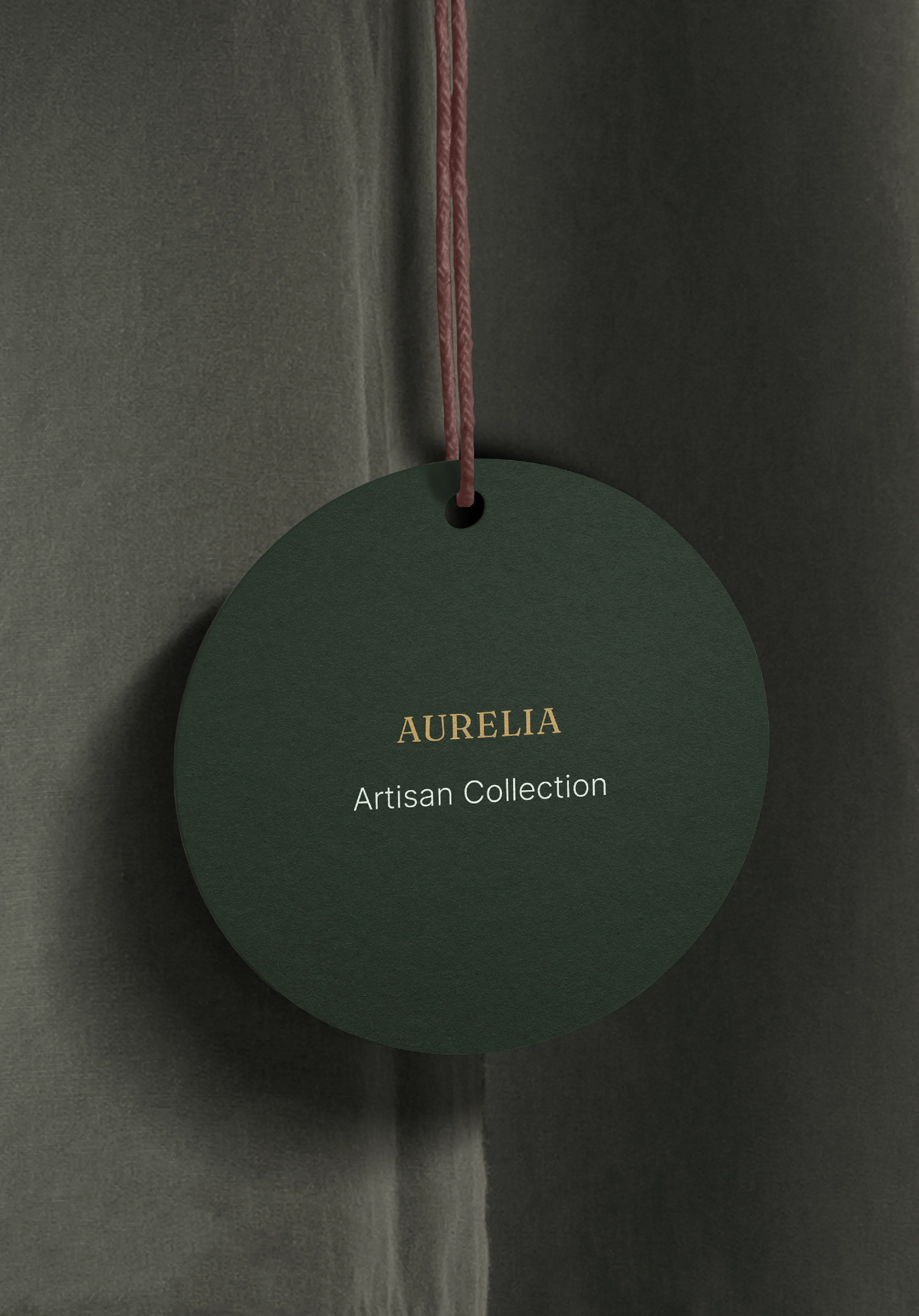 Aurelia atelier garment tag with refined typographic detailing.