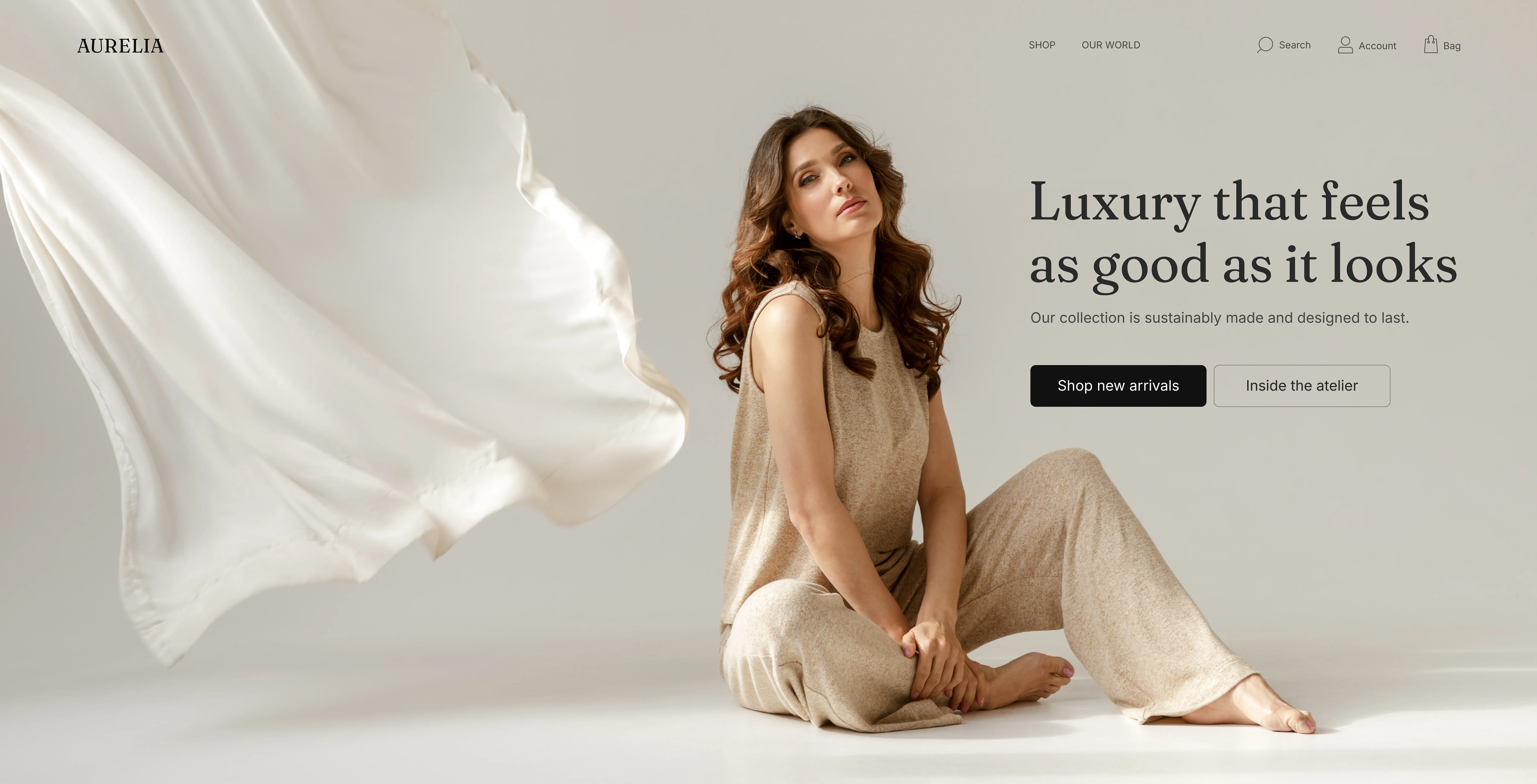 Aurelia luxury fashion website homepage featuring a model in neutral clothing.