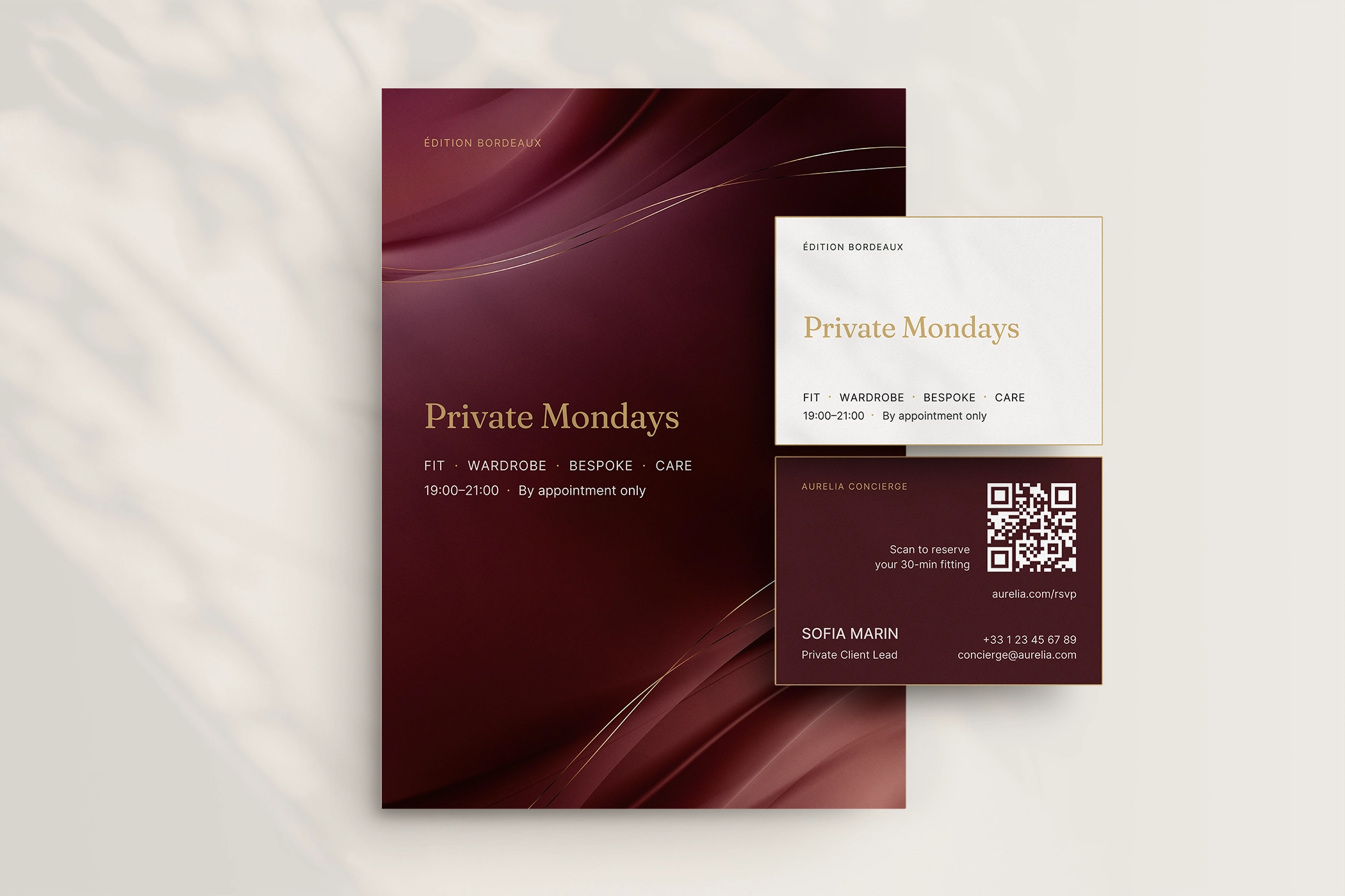 Aurelia private-client card and brochure in burgundy and ivory.