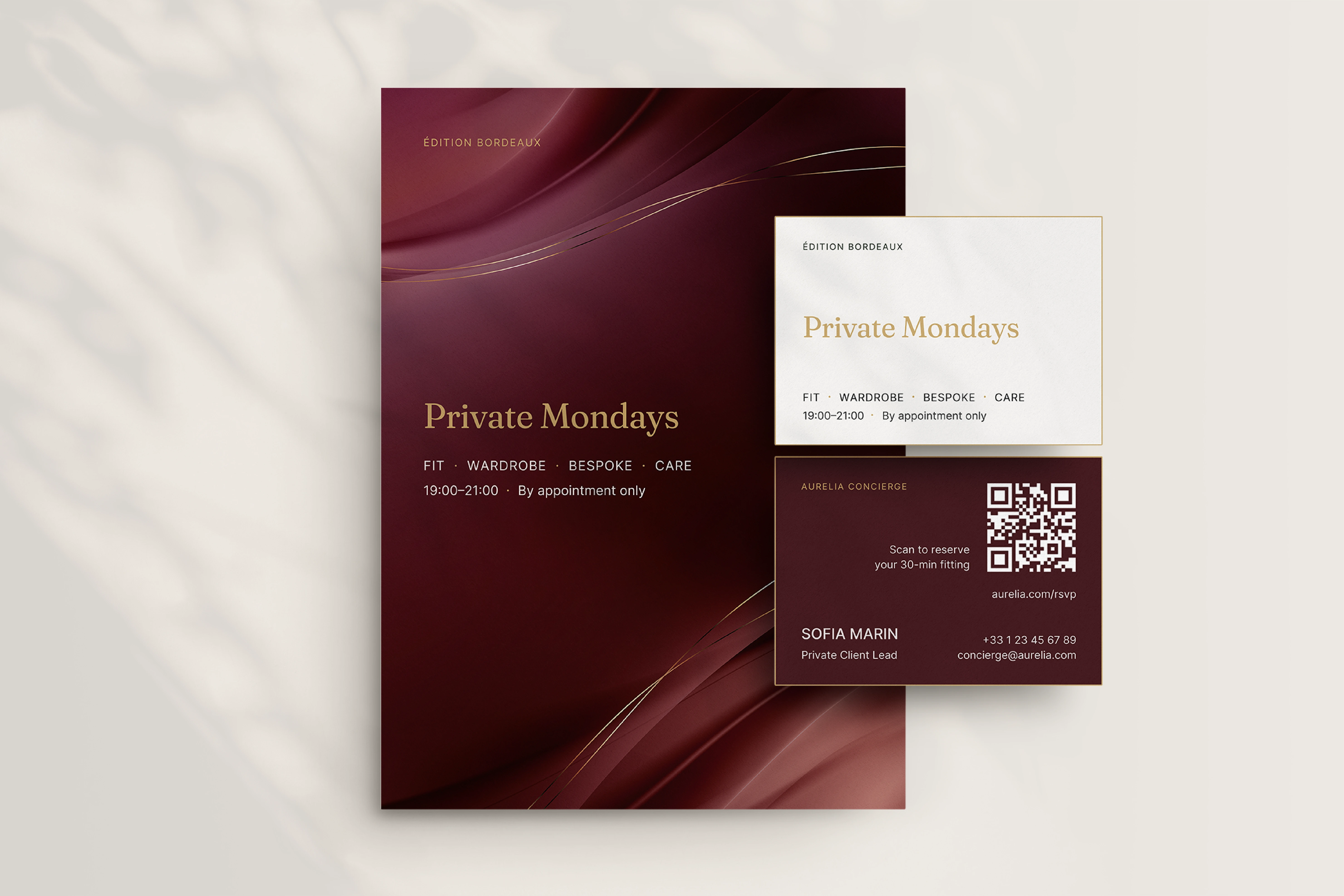 Aurelia private-client card and brochure in burgundy and ivory.