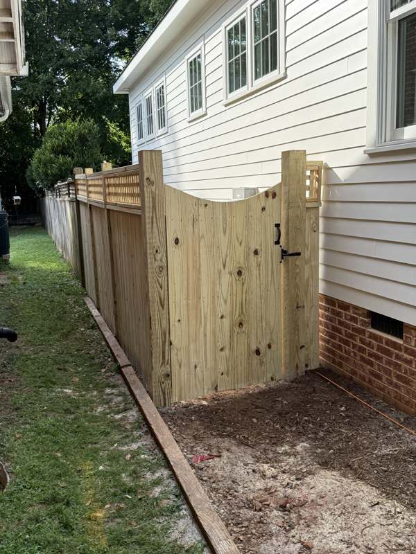 Wood fence gate by house, Raleigh NC
