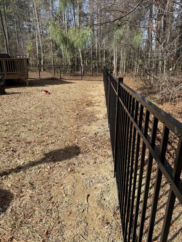 Aluminum fence install along tree line, Raleigh NC