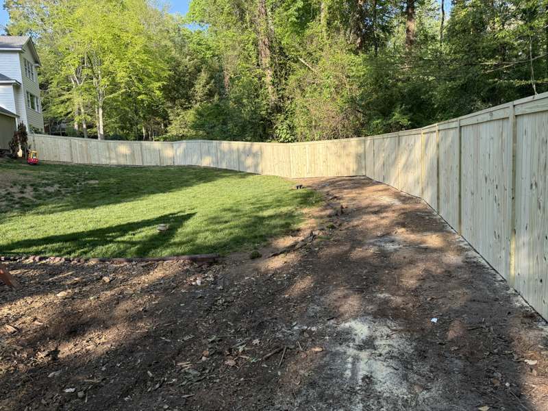 Wood fence with playset, Raleigh NC