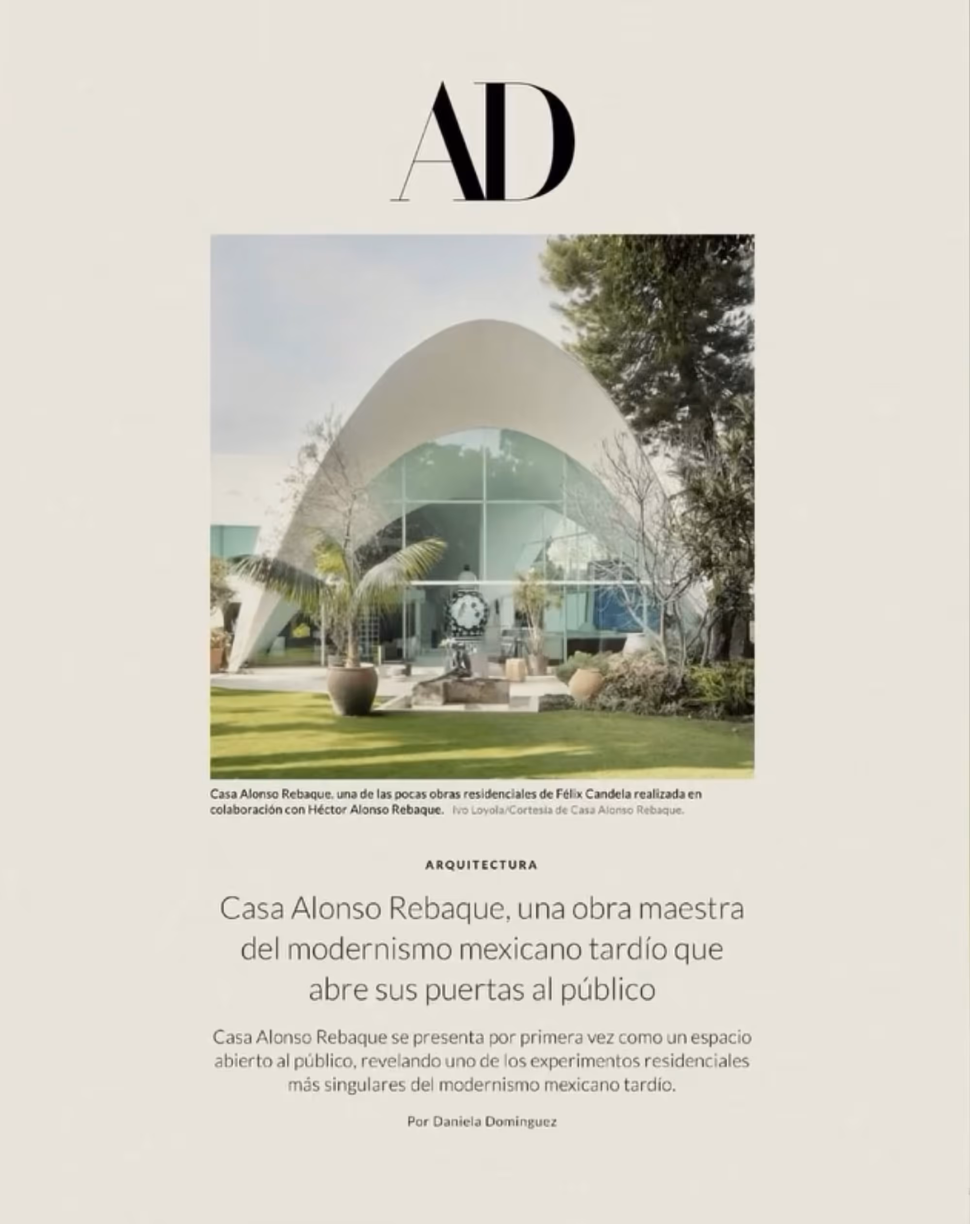 Front view of Casa Alonso Rebaque with a modern curved roof and large glass facade surrounded by trees and potted plants.