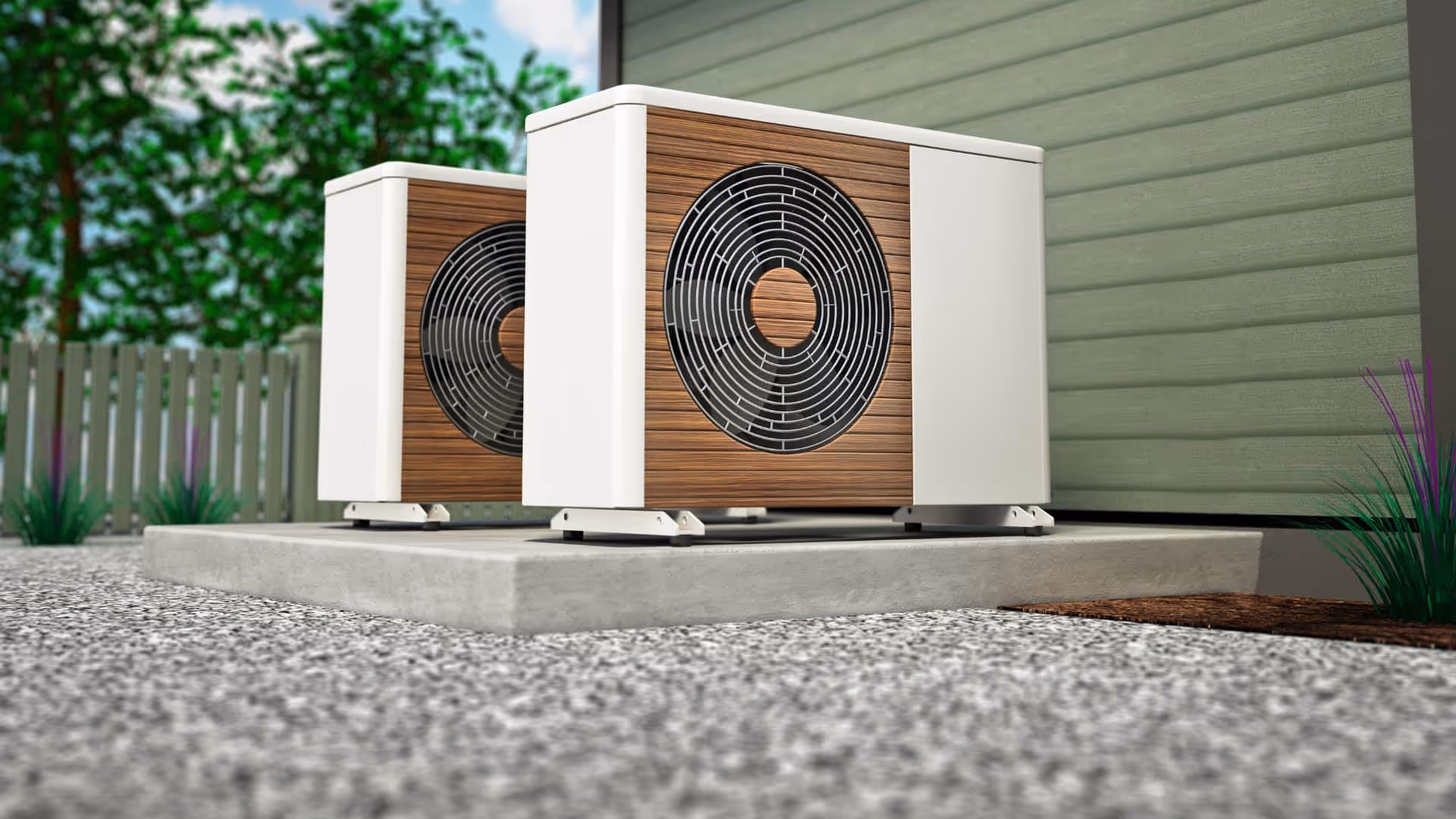 Two modern outdoor heat pump units with wooden paneling installed on a concrete slab beside a house.