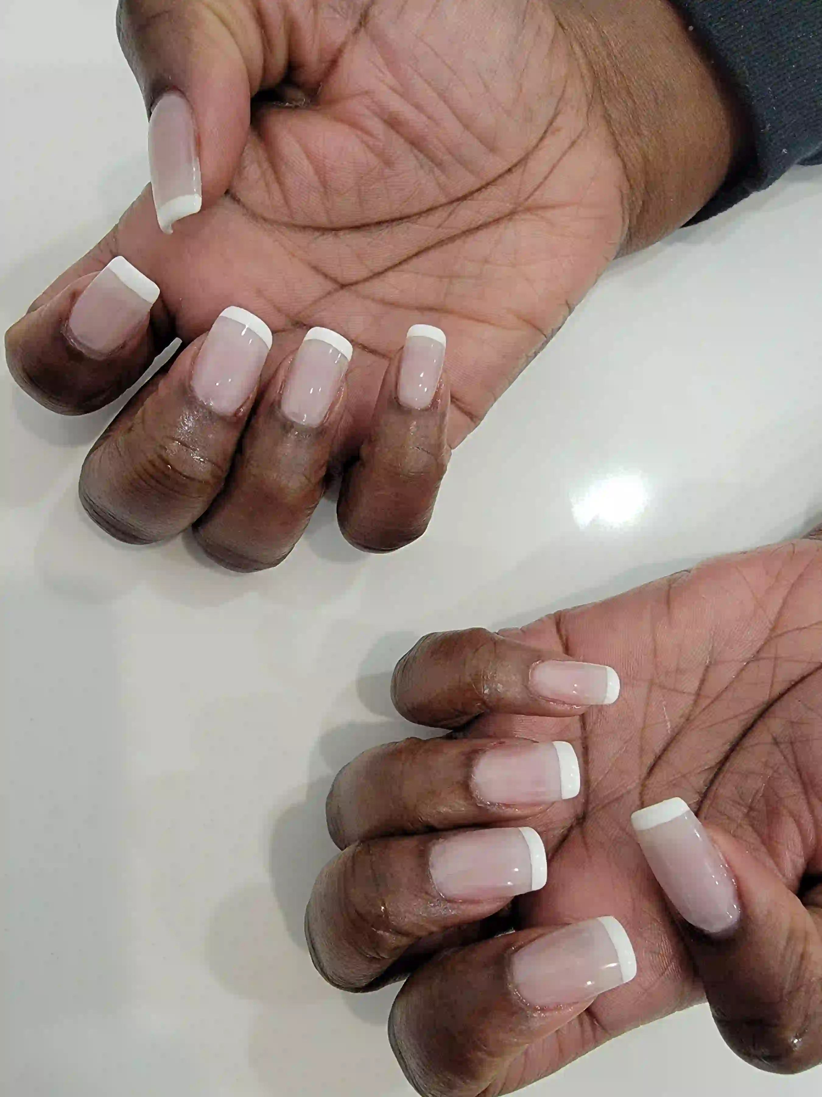 Classic French manicure with soft pink base and crisp white tips on square nails, elegant mobile manicure by Opalya in Toronto