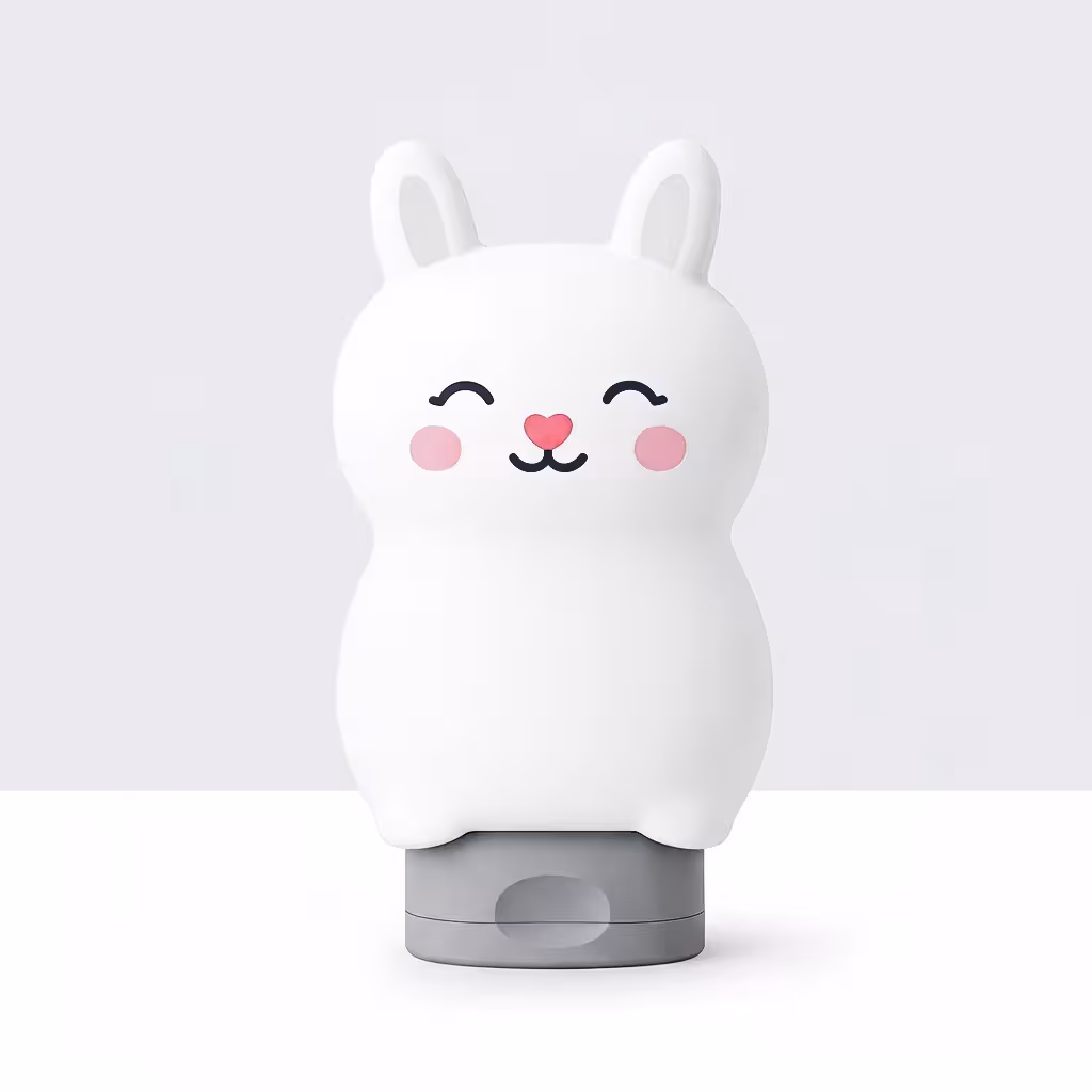 Milky Care white bunny-shaped kids’ shampoo bottle standing upright on a clean, bright background. The bottle has soft rounded ears, a smooth silicone finish, and a minimal premium design representing the brand’s gentle, milk-protein-based formula for children.