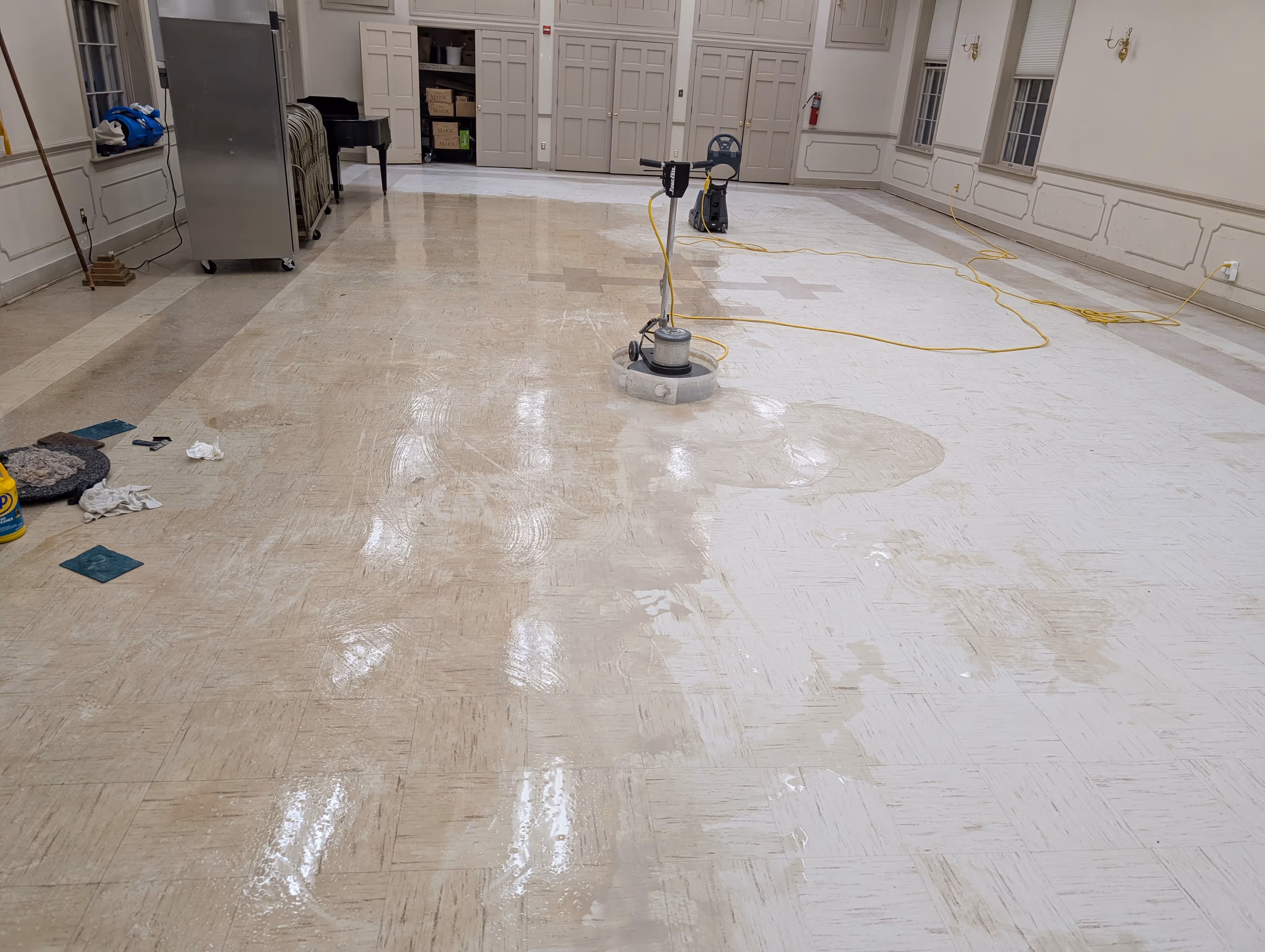 VCT wax stripping in progress by Total Cleaning Service