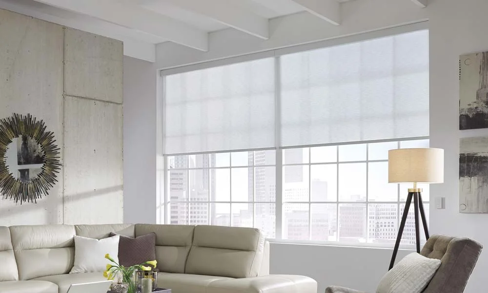 Living room with large window and city view.