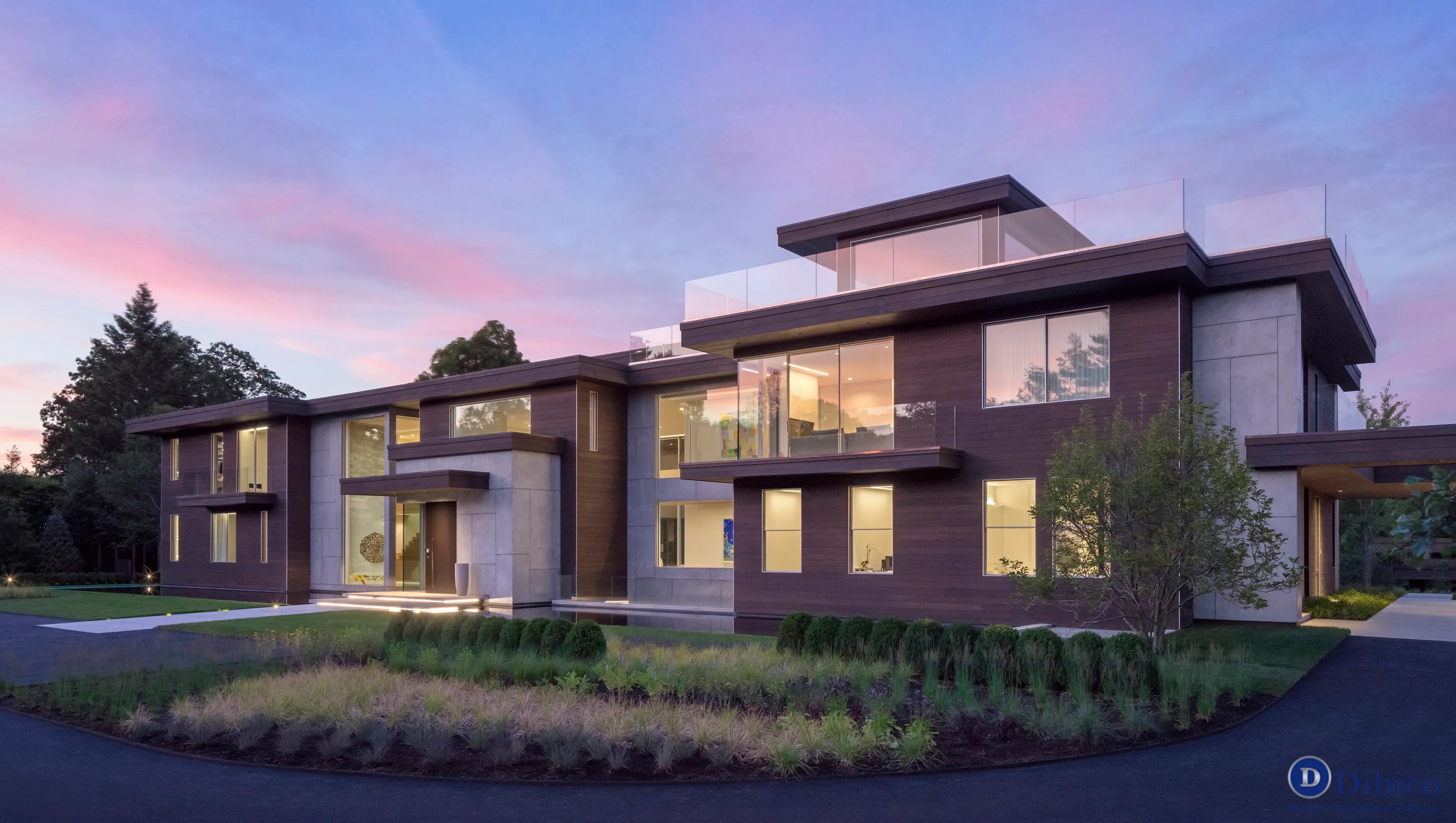 Modern two-story home at sunset.