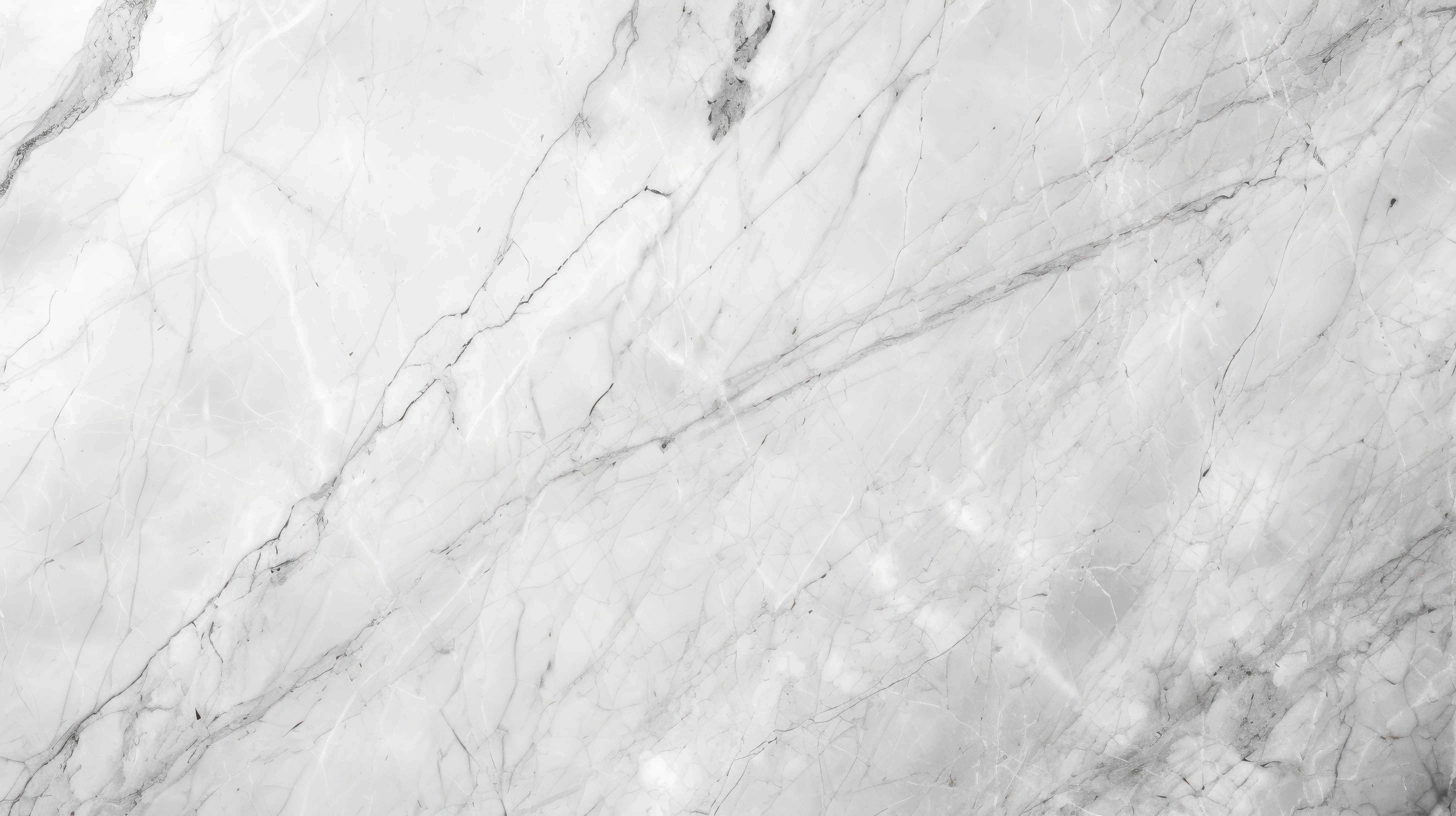 White marble surface with subtle gray veining and natural texture details.
