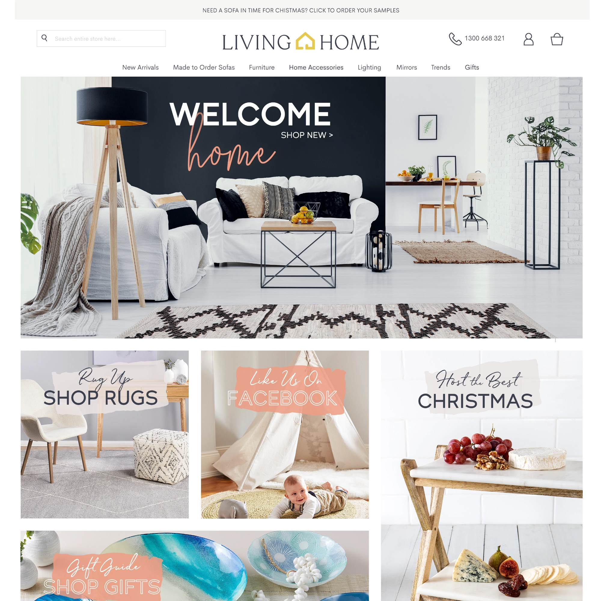 Living Home website snapshot featuring a modern living room with white sofas, black and beige cushions, a wooden tripod floor lamp, metal and wood coffee table, and dining area with a plant on a stand.