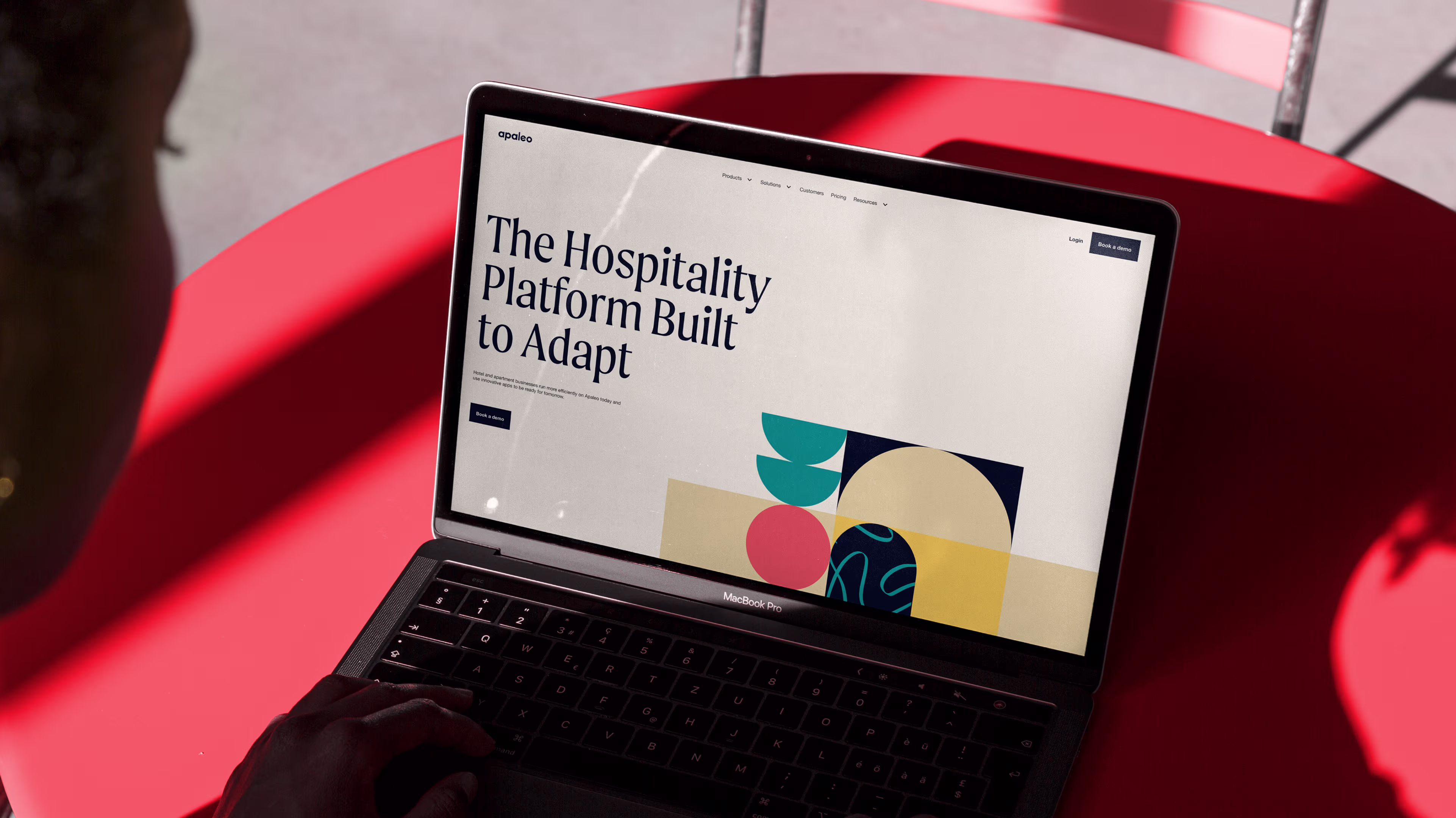 Website design on a laptop mockup for Apaleo
