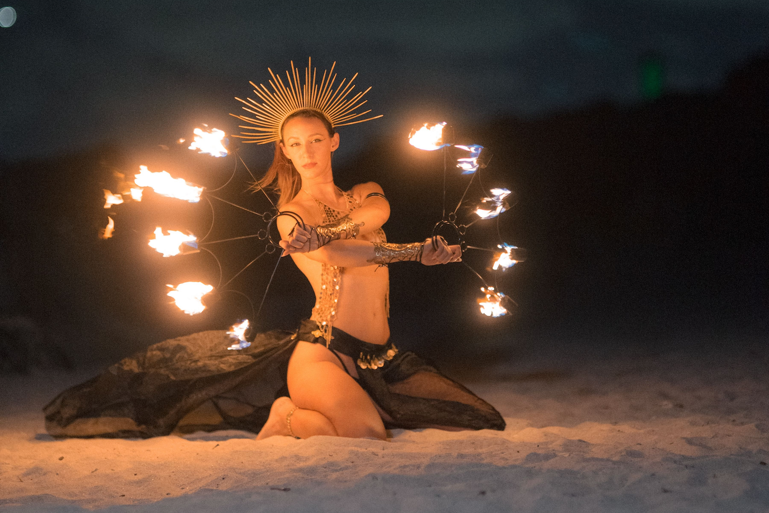 fire dancer on Miami Beach with fire fans