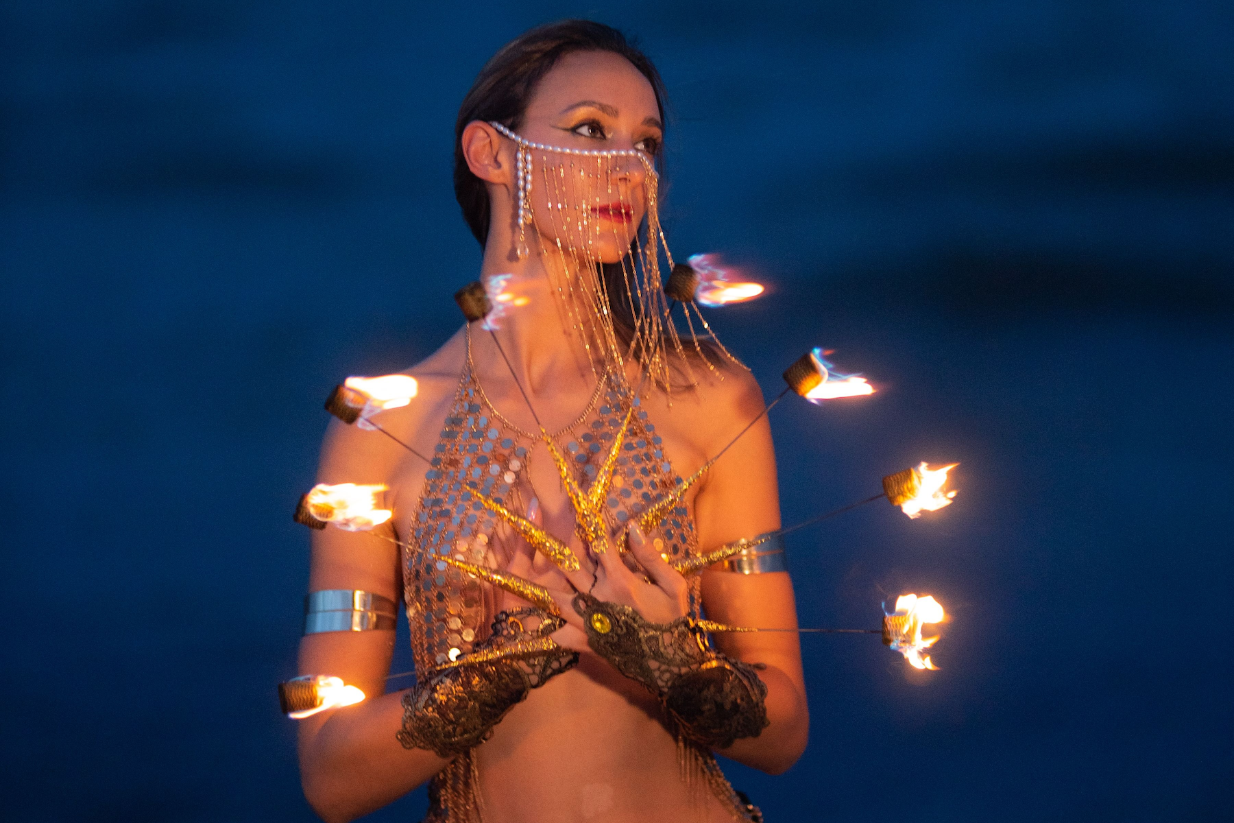 fire dancer with fire fingers on Miami Beach