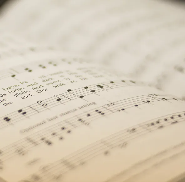 An open book with sheet music on it.