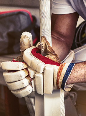 Cricket player sitting at velocity cricket. 