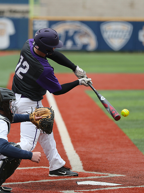Softball player hitting the ball.