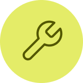 Symbol eines Schraubenschlüssels in einem grünen Kreis.