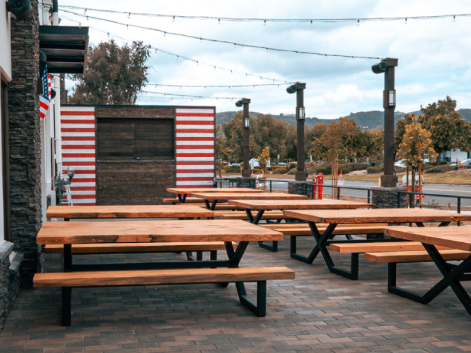 Temecula Valley wine country vineyard restaurant dining table with rolling hills at  sunset — best places to eat 2026 