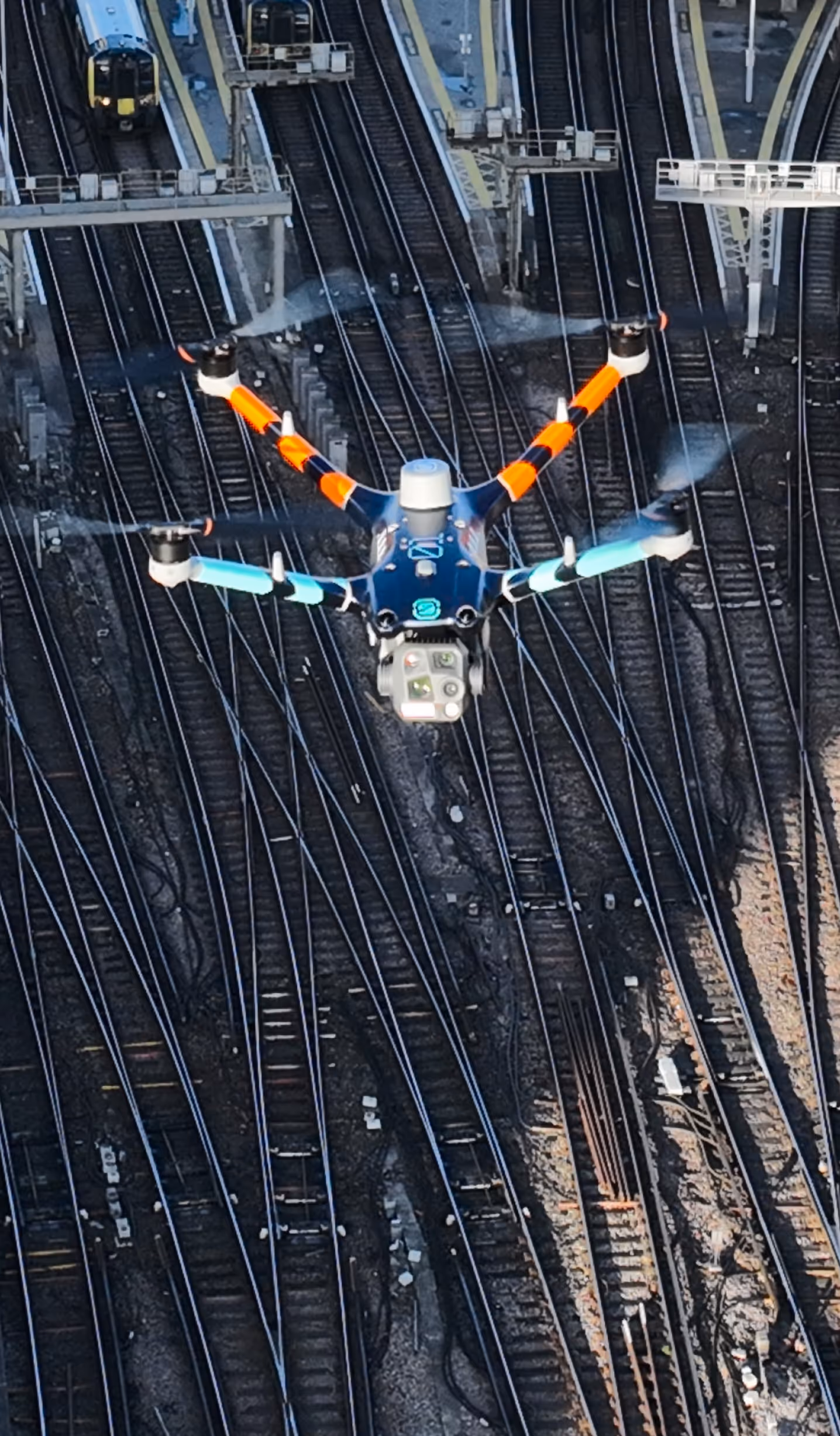 Skybound drone above the train station.