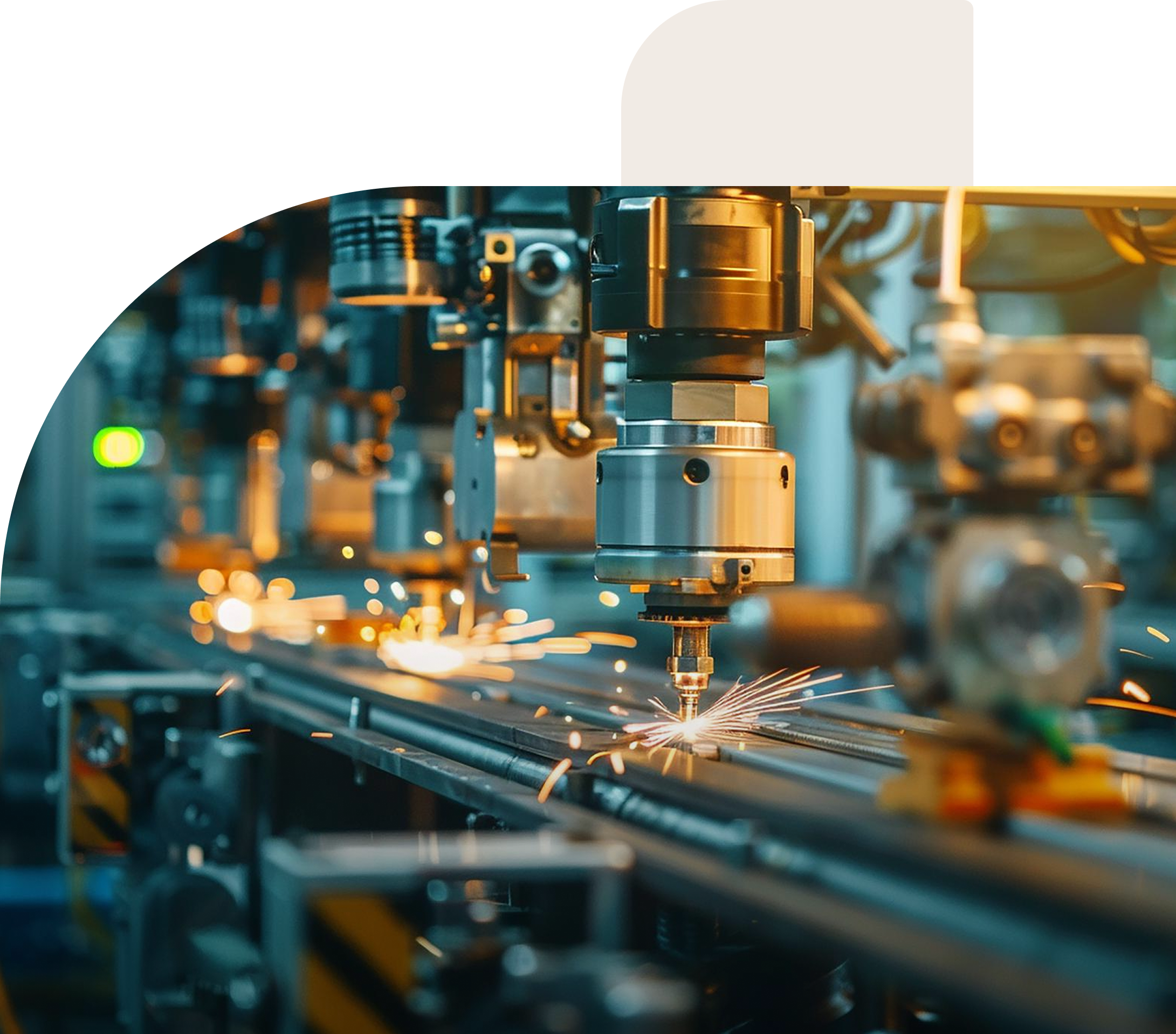 Close-up of an automated machine using a laser to cut metal with sparks flying in an industrial factory setting.