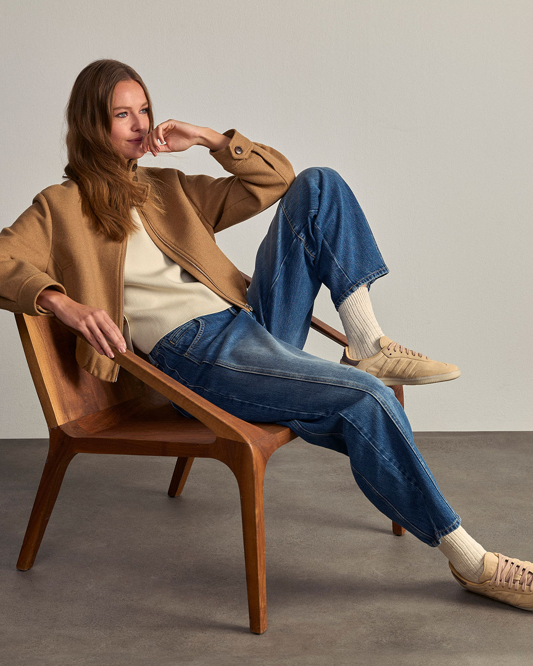 Positive young multiracial friends eating fast food and drinking beer in outdoor cafe