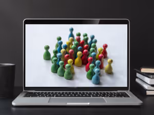a laptop with a picture of a lot of colourful wooden board game pieces on the screen